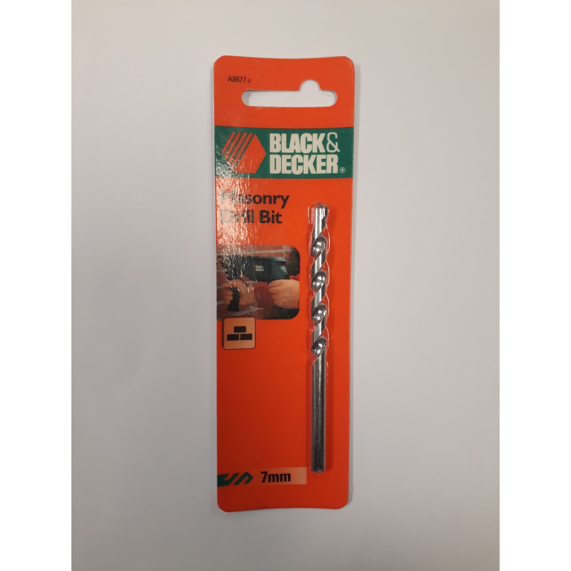Photo of BLACKDECKER masonry drill bit 7mm A8677 in retail packaging, front angle, on white background.