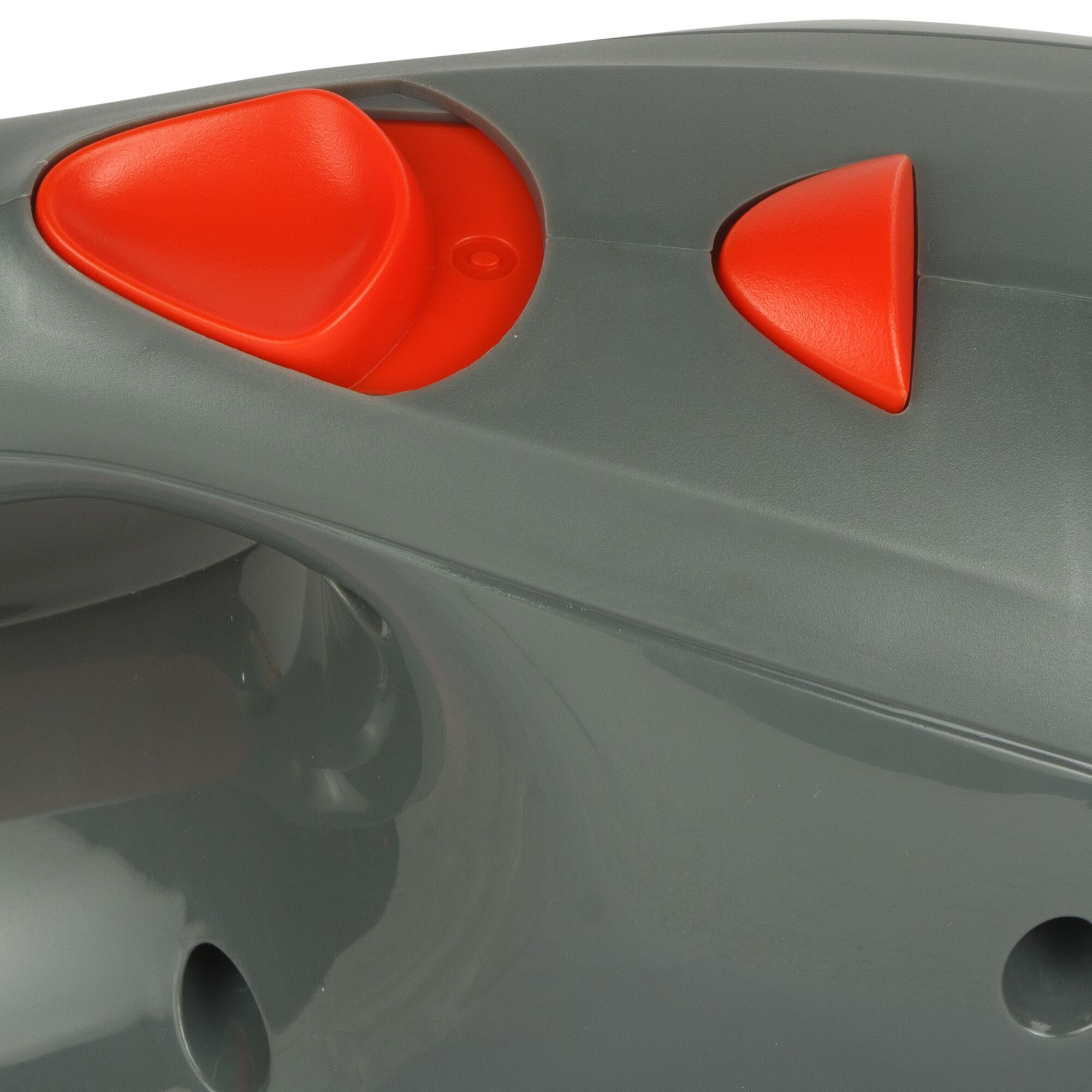 BLACKDECKER ACV1205 close-up of red control buttons on grey plastic surface, photography category.
