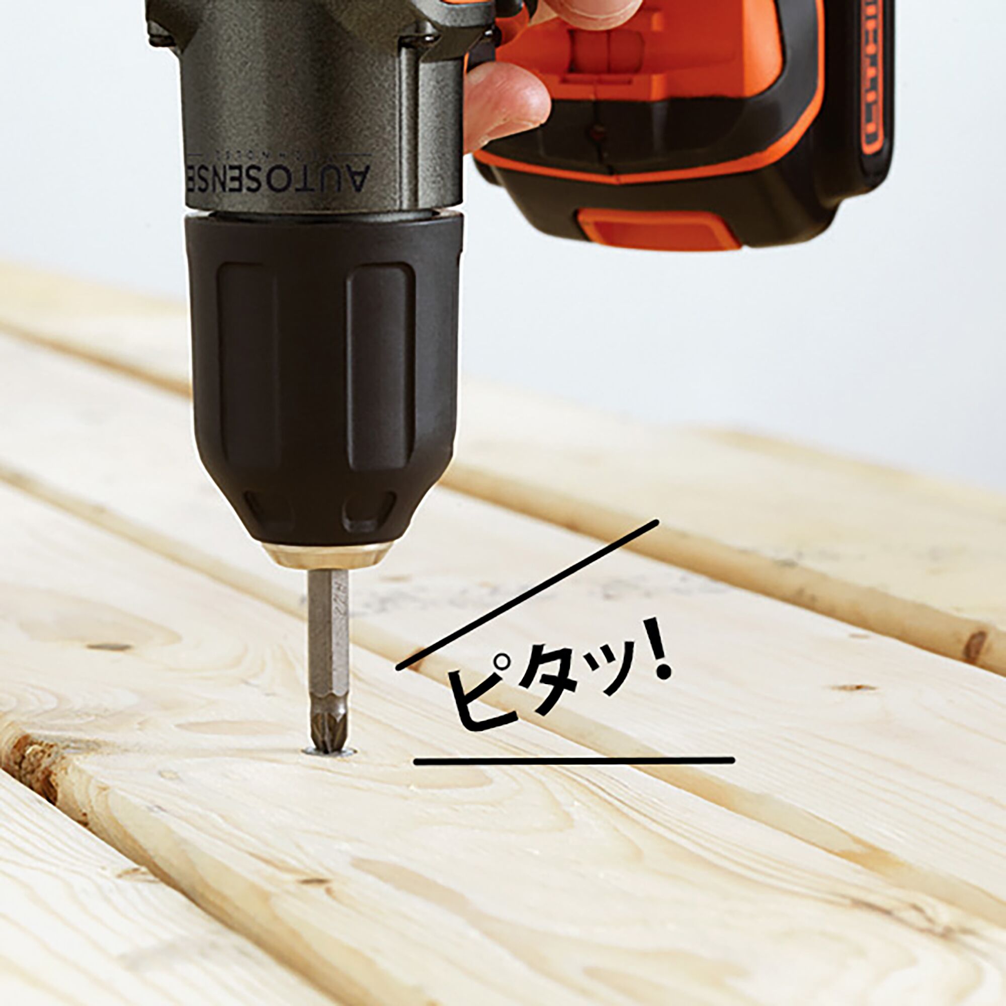 BLACKDECKER AUTO01K2 cordless drill driving screw into light wood, close-up angle.