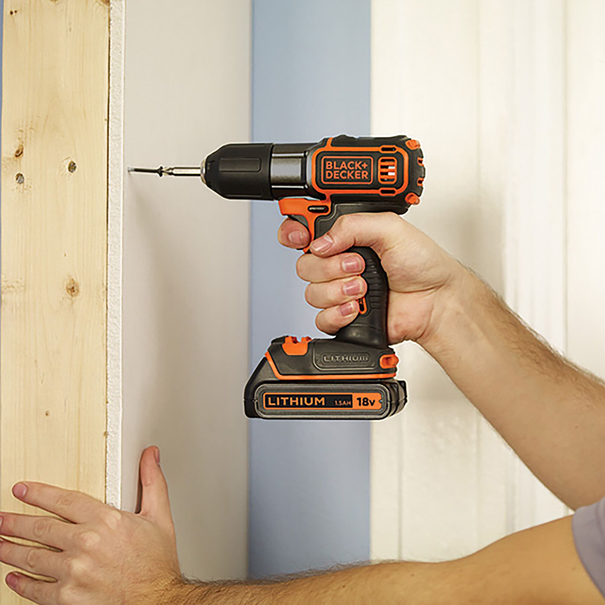 BLACKDECKER AUTO01 cordless drill with 18V lithium battery, used for drilling into wood and wall.