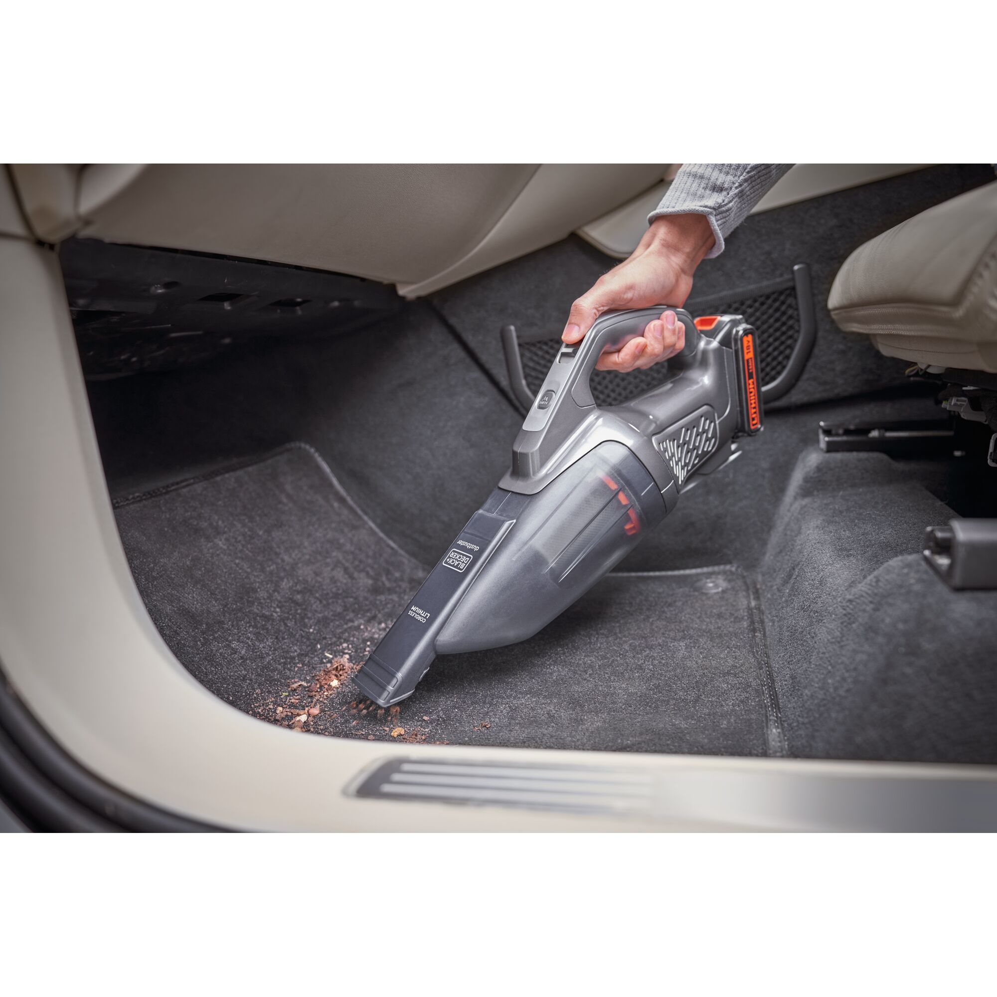 BLACKDECKER BCHV001D1E handheld vacuum cleaning car floor carpet, close-up angle.