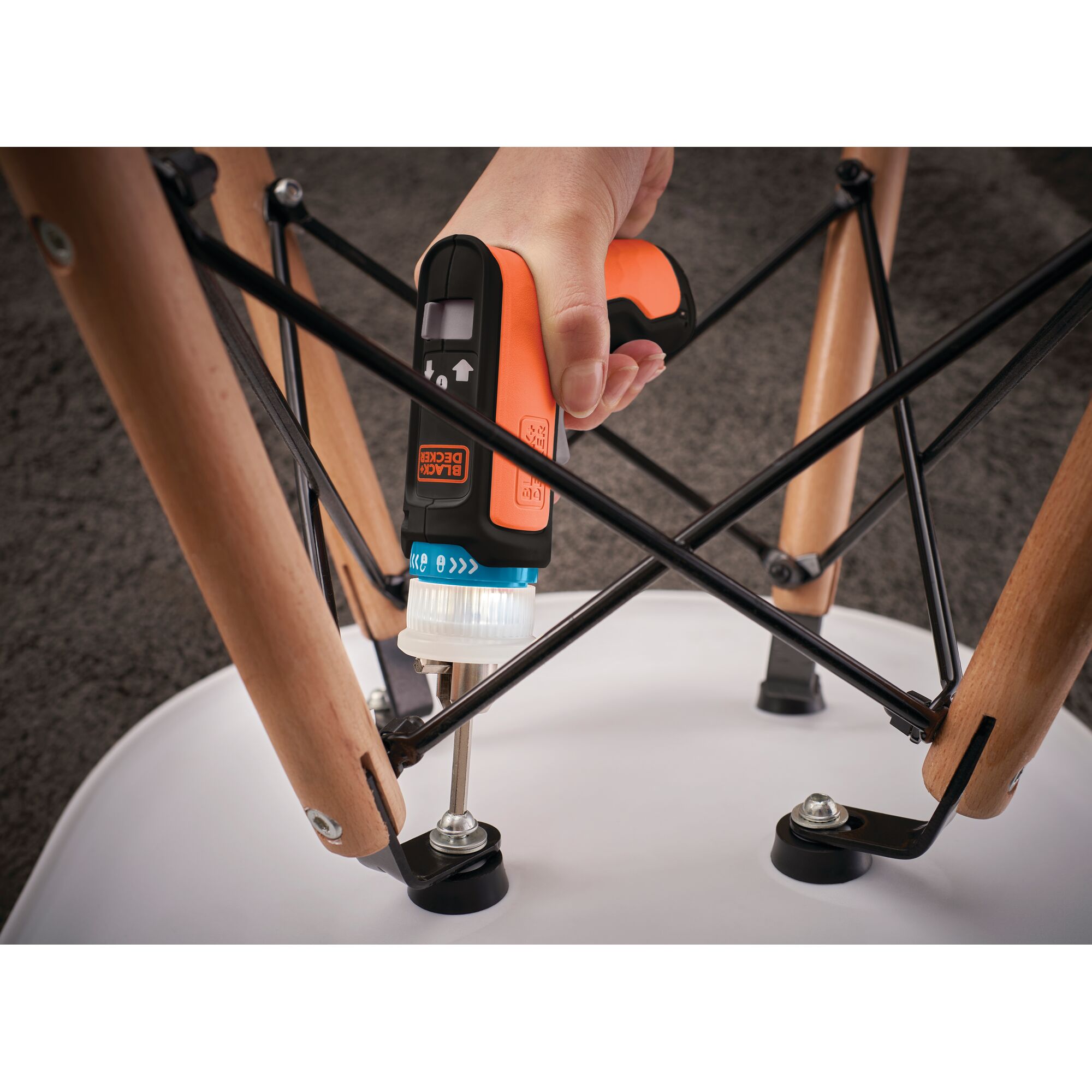 BLACKDECKER BCRTA601 cordless screwdriver used to assemble a chair, close-up angle.