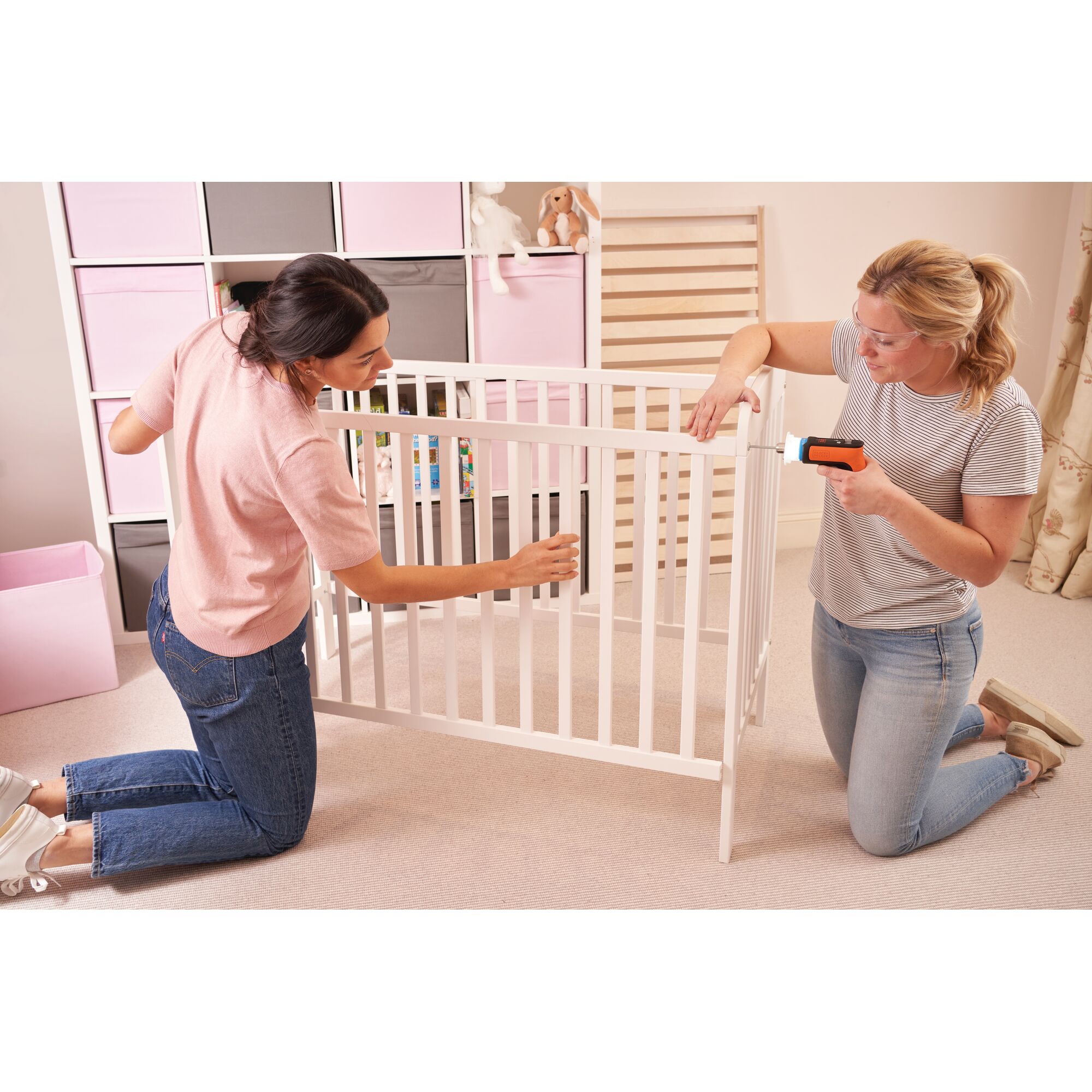 Photo of BLACKDECKER BCRTA601 cordless tool used to assemble a white crib in a nursery room.
