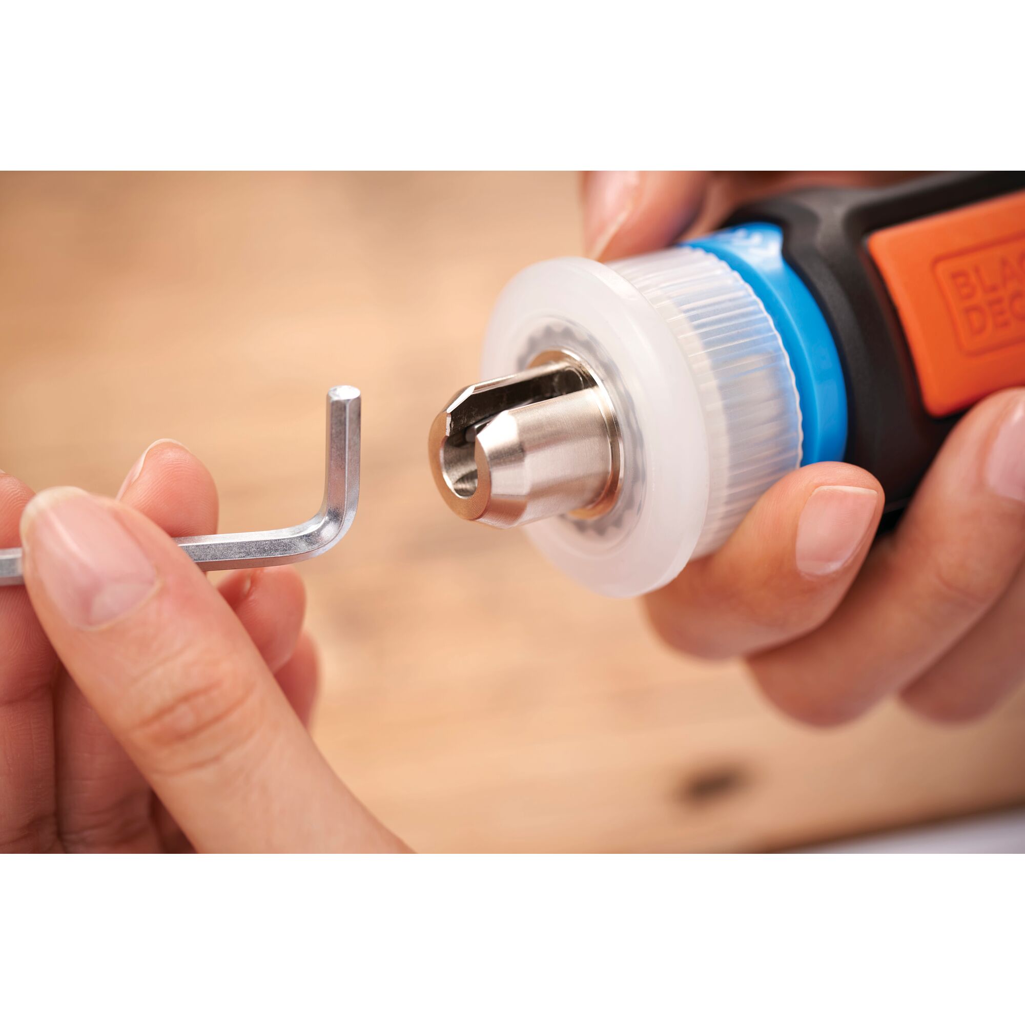 BLACKDECKER BCRTA601 photography of tool chuck and hex key in close-up.