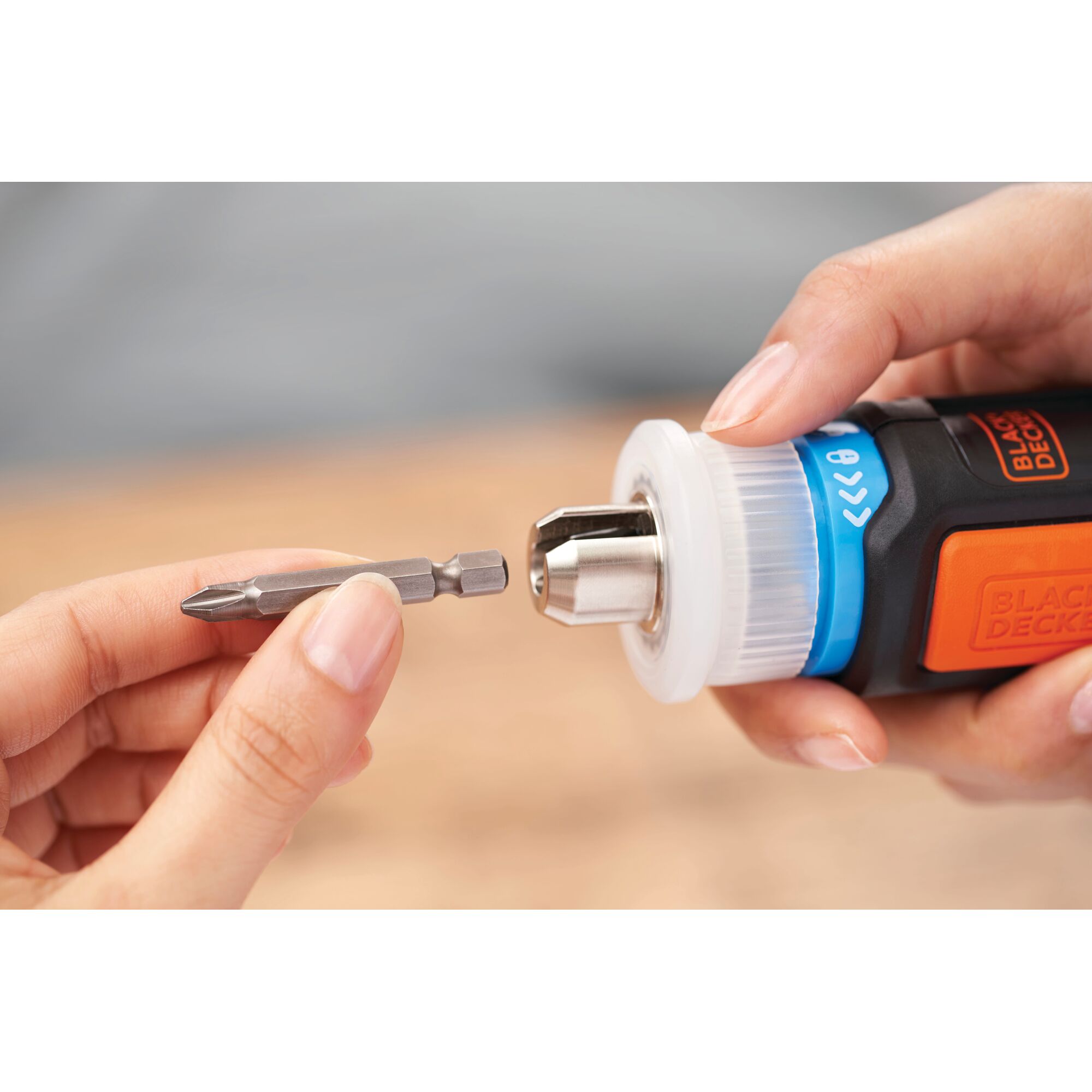 BLACKDECKER BCRTA601 close-up of screwdriver bit being inserted into electric tool in hand.