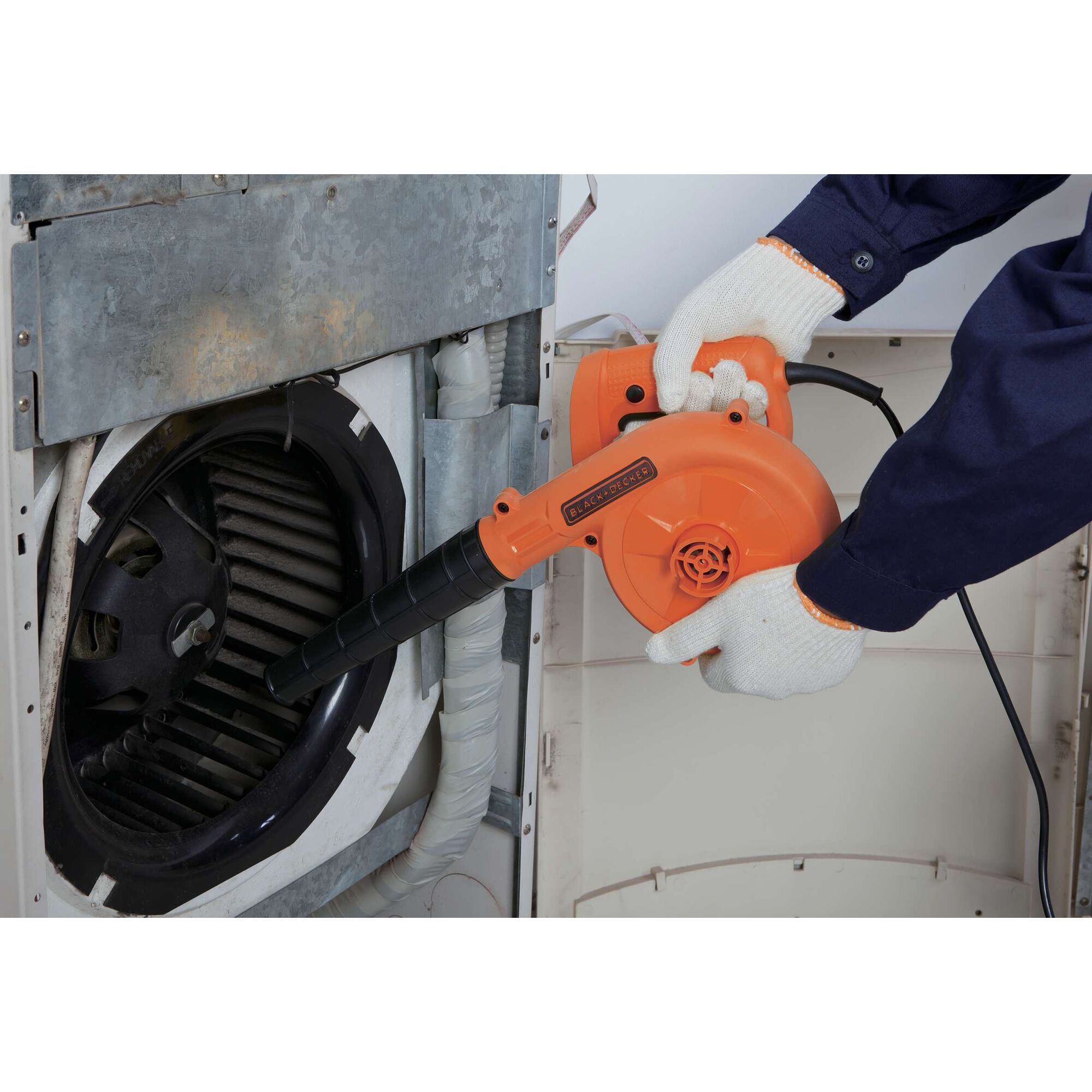BLACKDECKER BDB600 orange blower used for cleaning appliance; close-up of product in use.