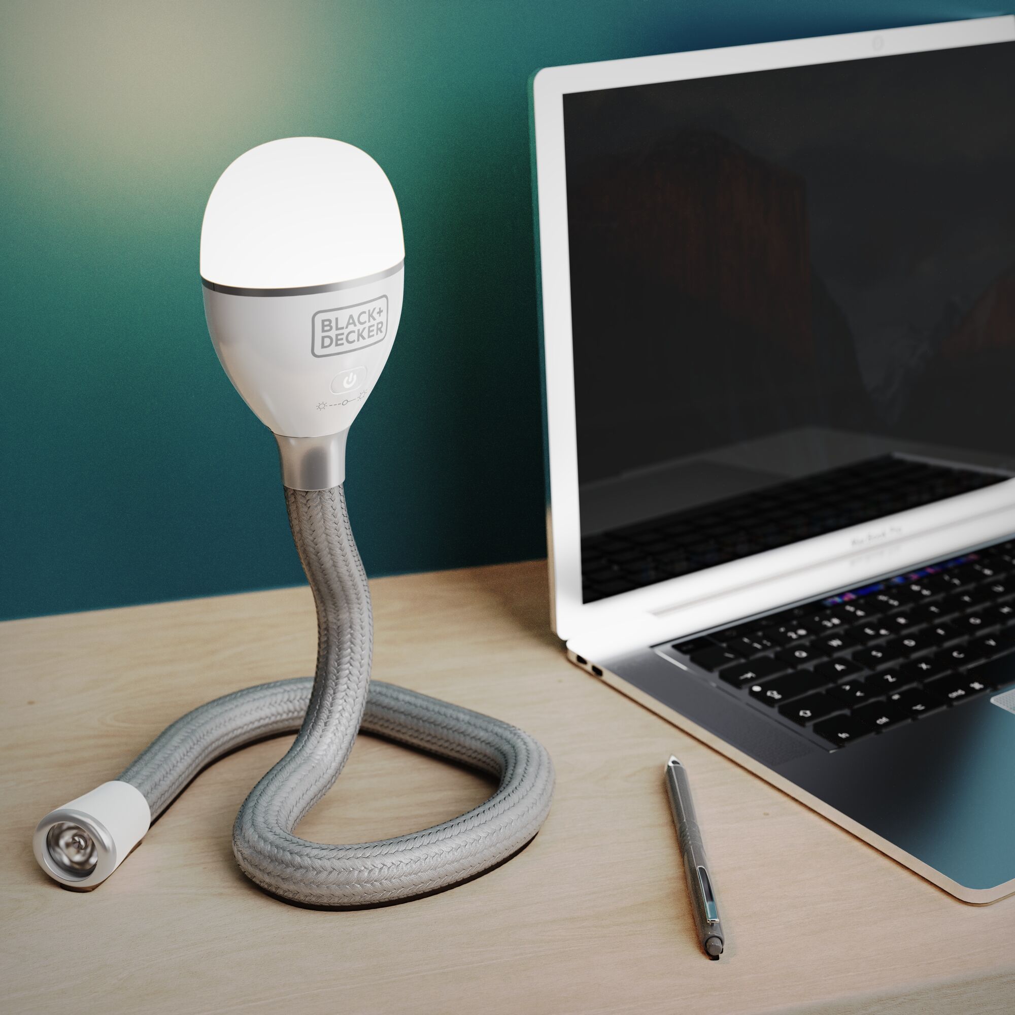 BLACK+DECKER BDCFSL01 flexible table lamp with braided cord next to a laptop and pen.