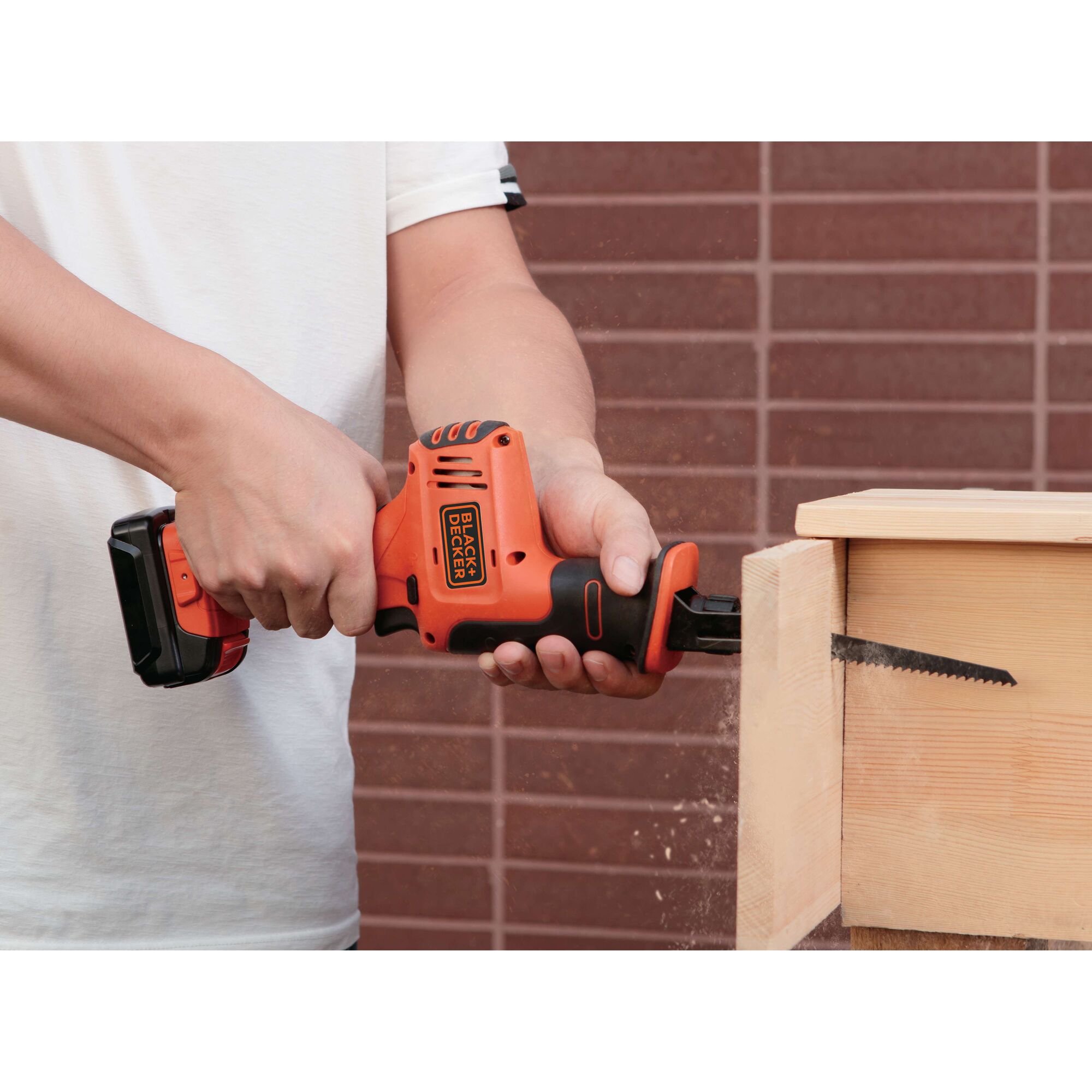 BLACKDECKER BDR12K cordless reciprocating saw cutting wood, close-up photography