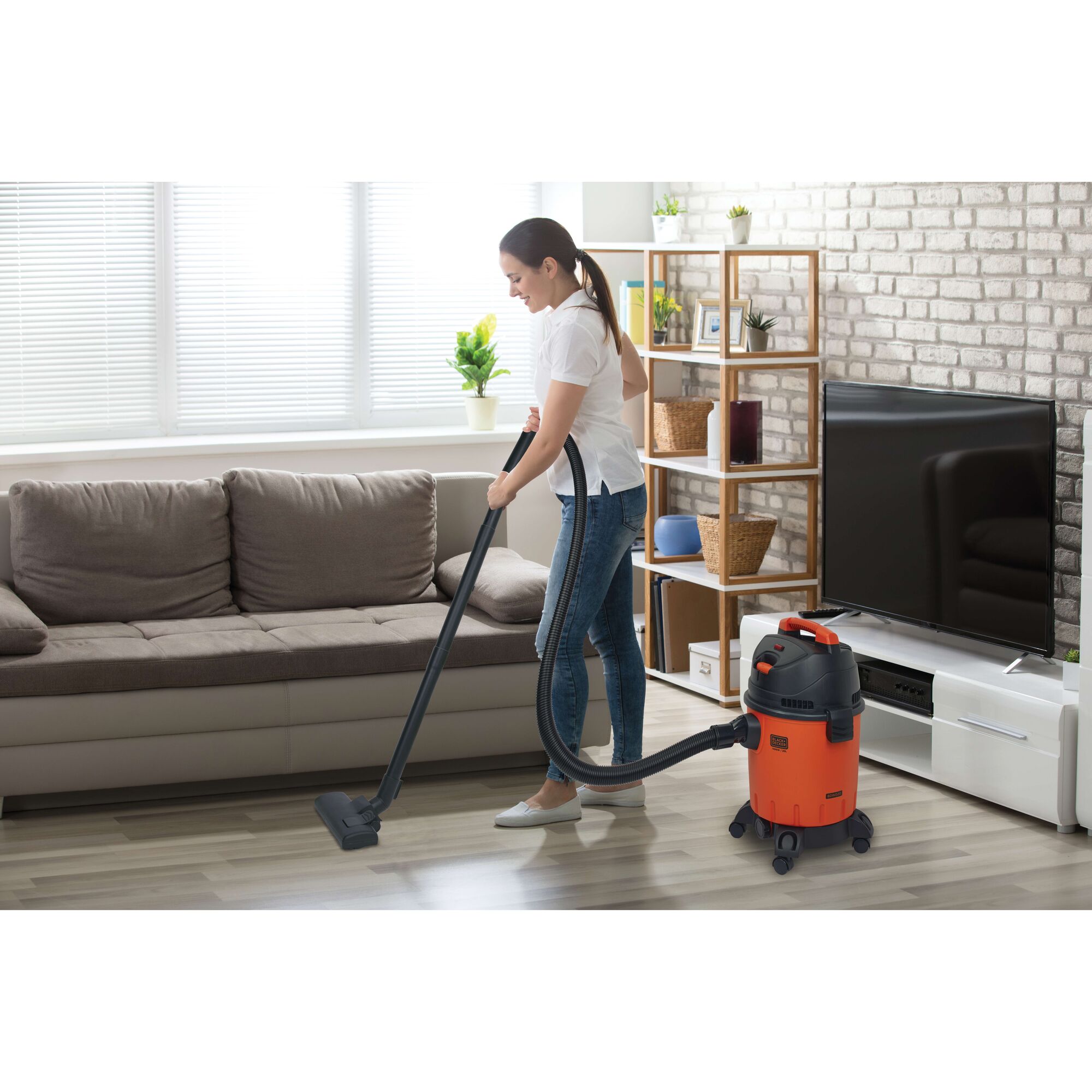 Photo of BLACKDECKER BDWD20 wet and dry vacuum cleaner in use on living room floor.