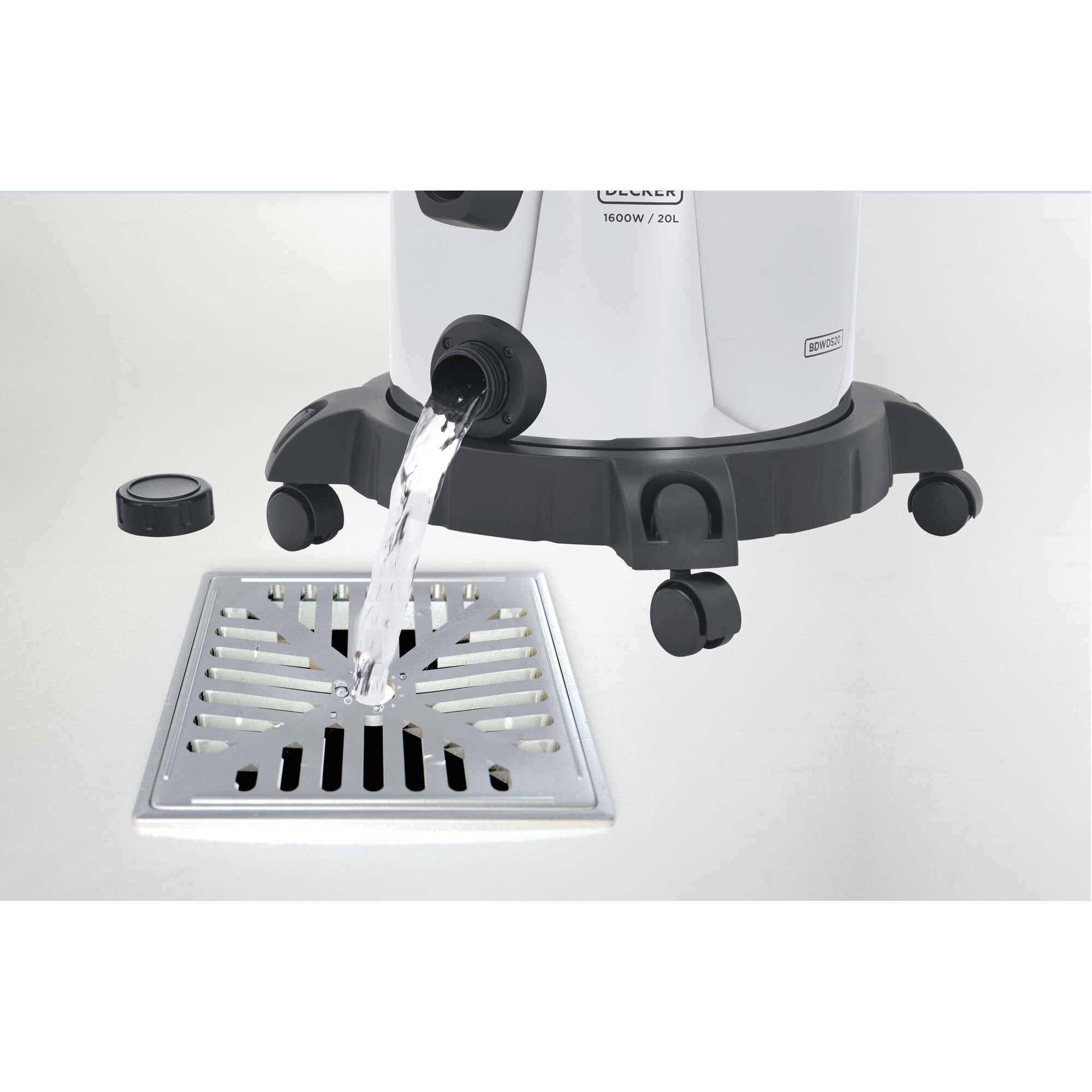 BLACKDECKER BDWDS20 wet and dry vacuum draining water into a floor grate, side angle, white background.