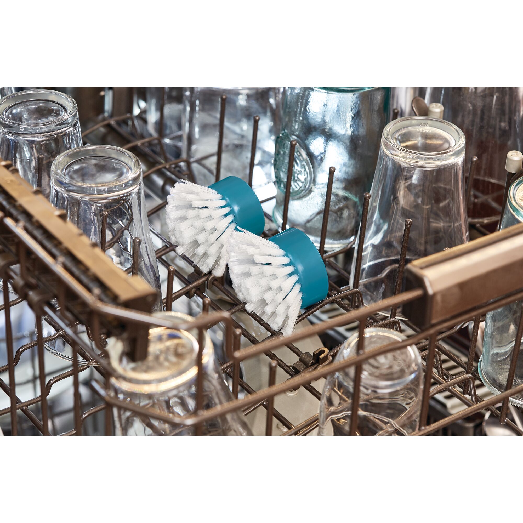 BLACKDECKER BHPC110 blue brush heads in dishwasher with glassware, product category photography.