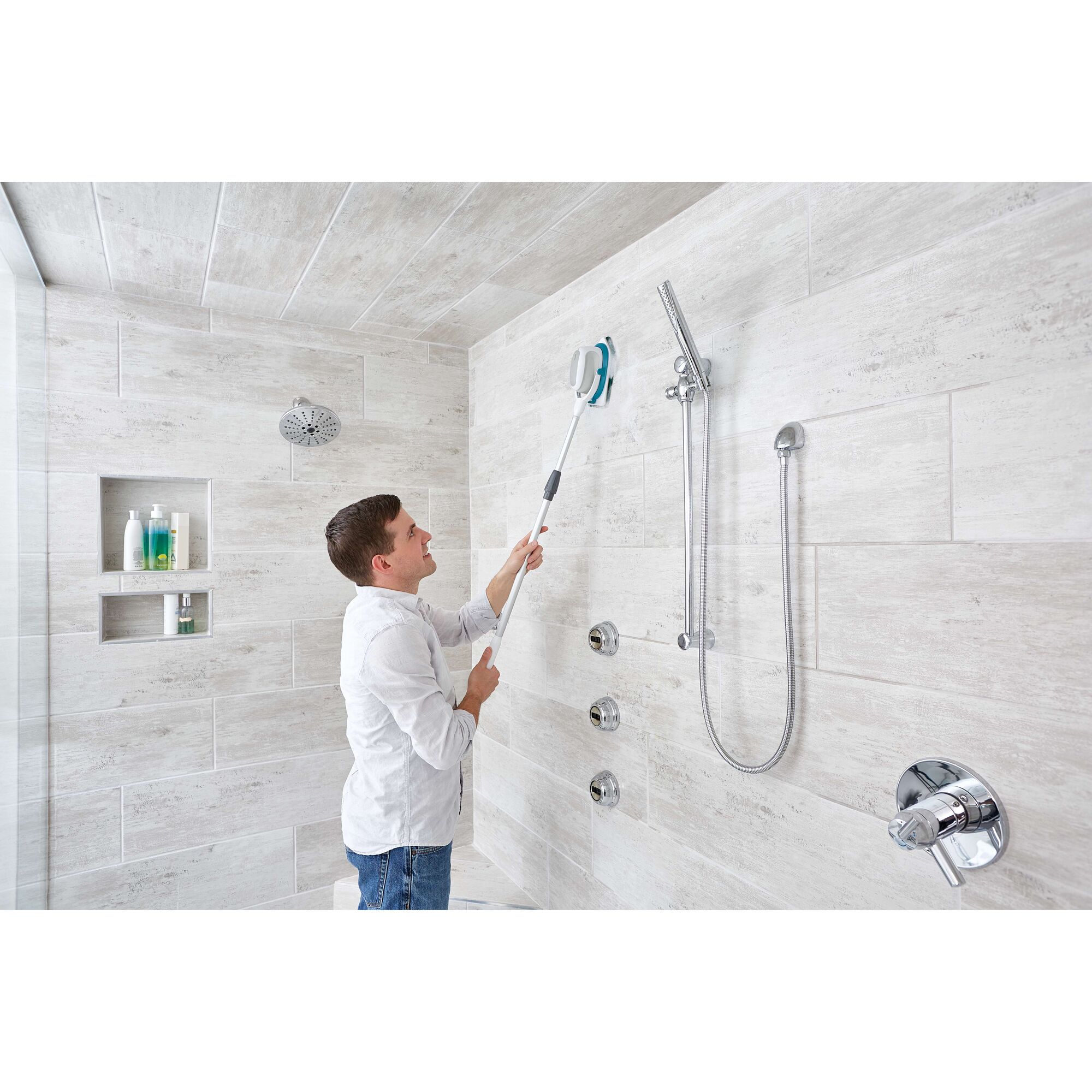 Photo of BLACKDECKER BHPC220 bathroom scrubber cleaning shower wall tiles.