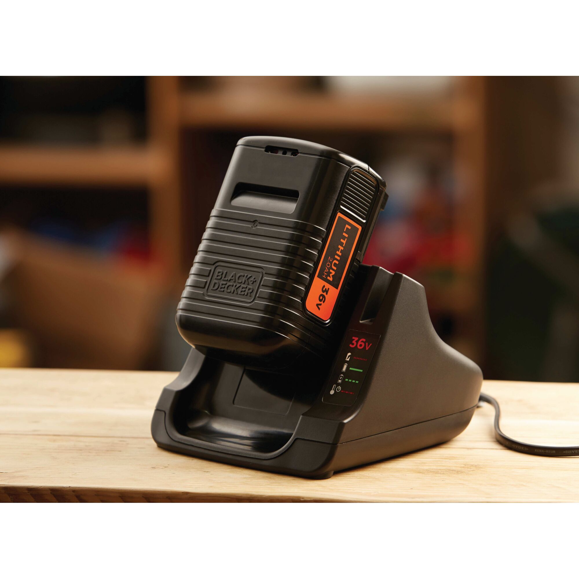 BLACKDECKER BL20362 36V lithium battery charger on wooden table, close-up photo.