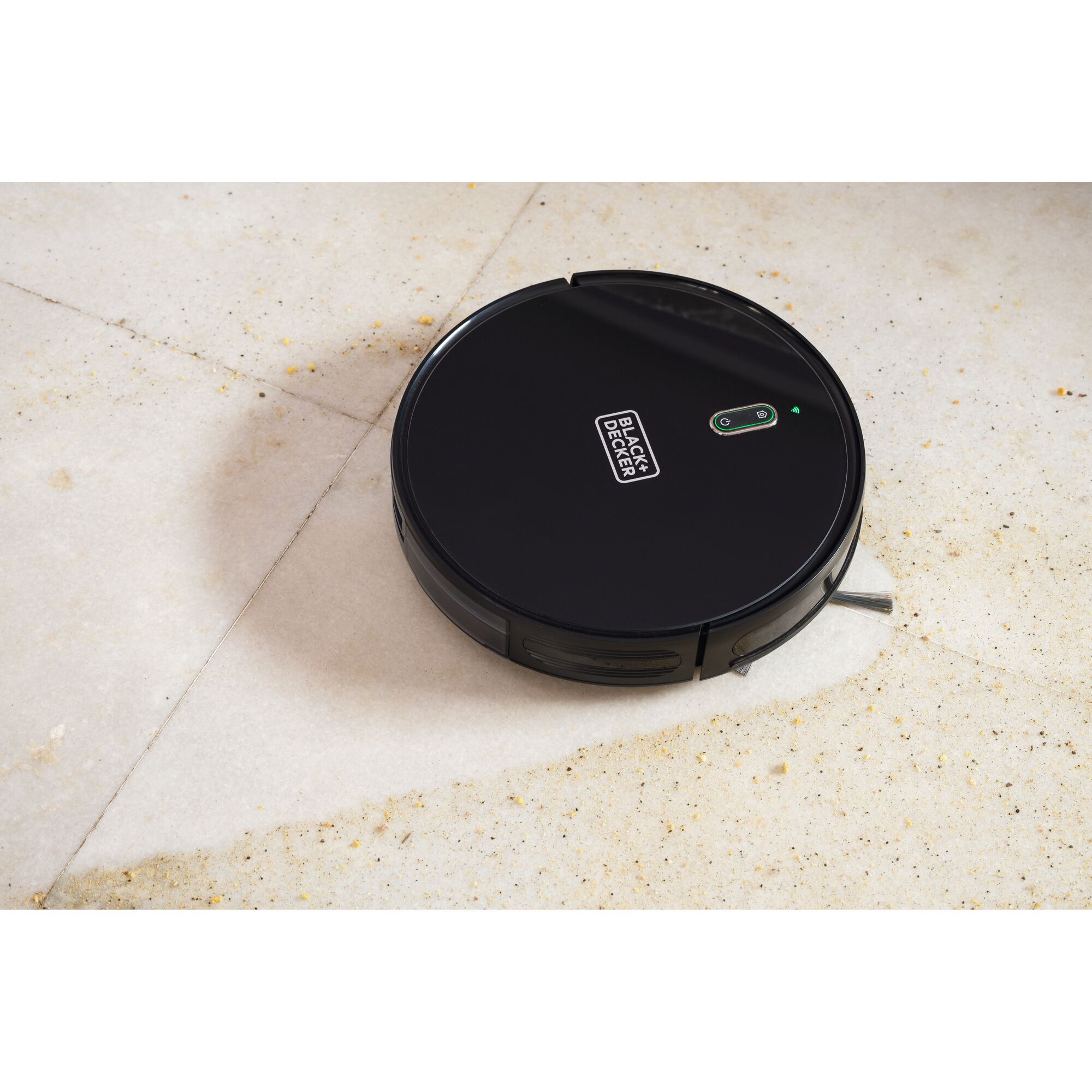 BLACKDECKER BRVA425B00 black robotic vacuum cleaner on tiled floor, top angle.