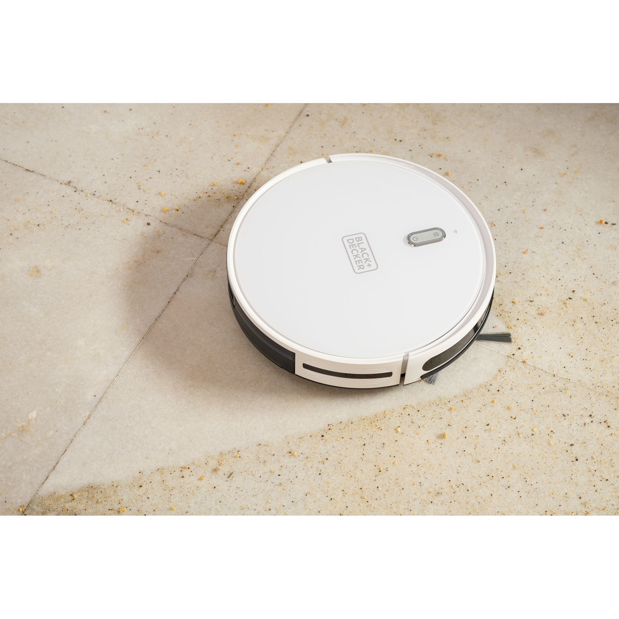 Photo of BLACKDECKER BRVA425B10 white robotic vacuum cleaner on a tile floor.