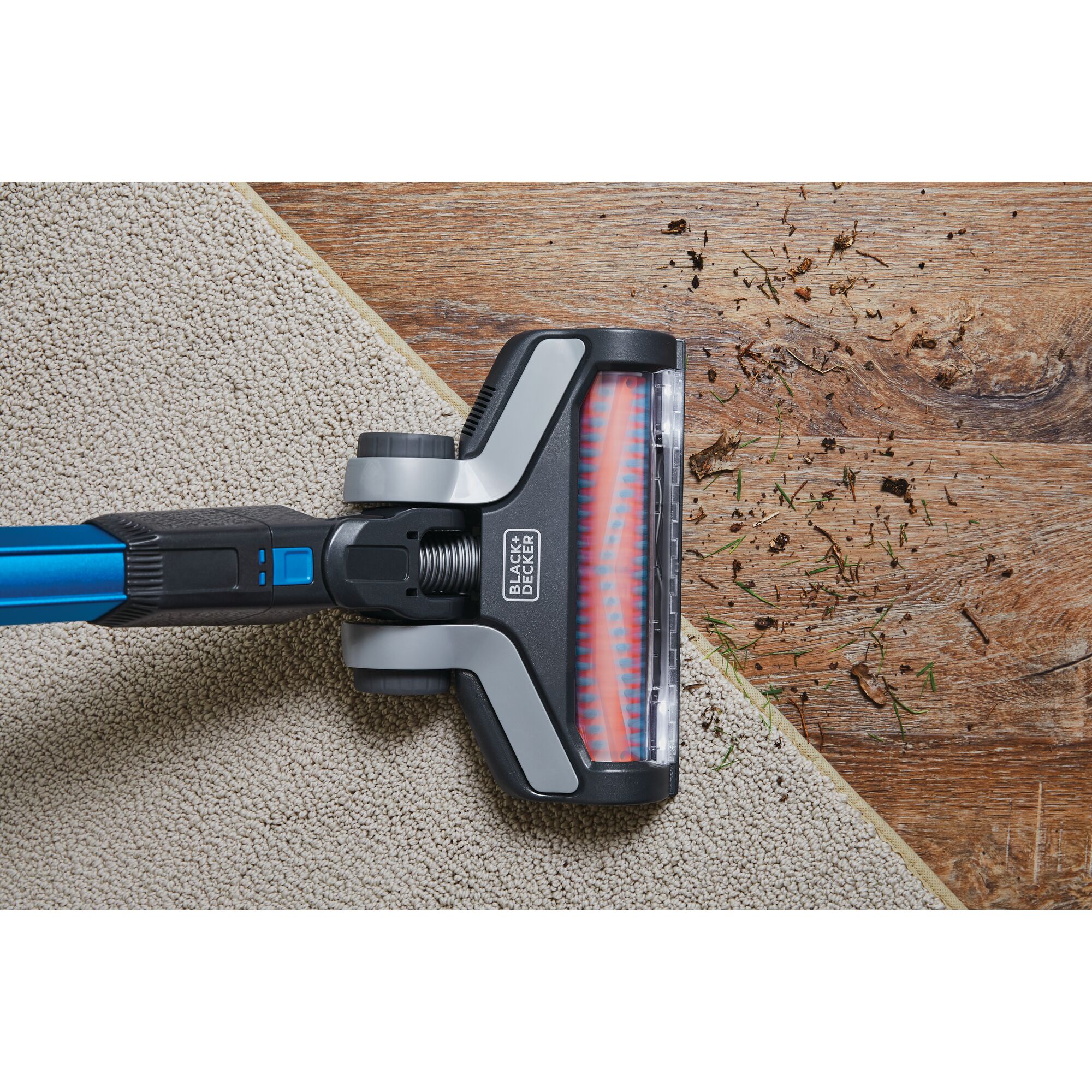 BLACKDECKER BSV2020G stick vacuum head cleaning carpet and hard floor, top view photography.