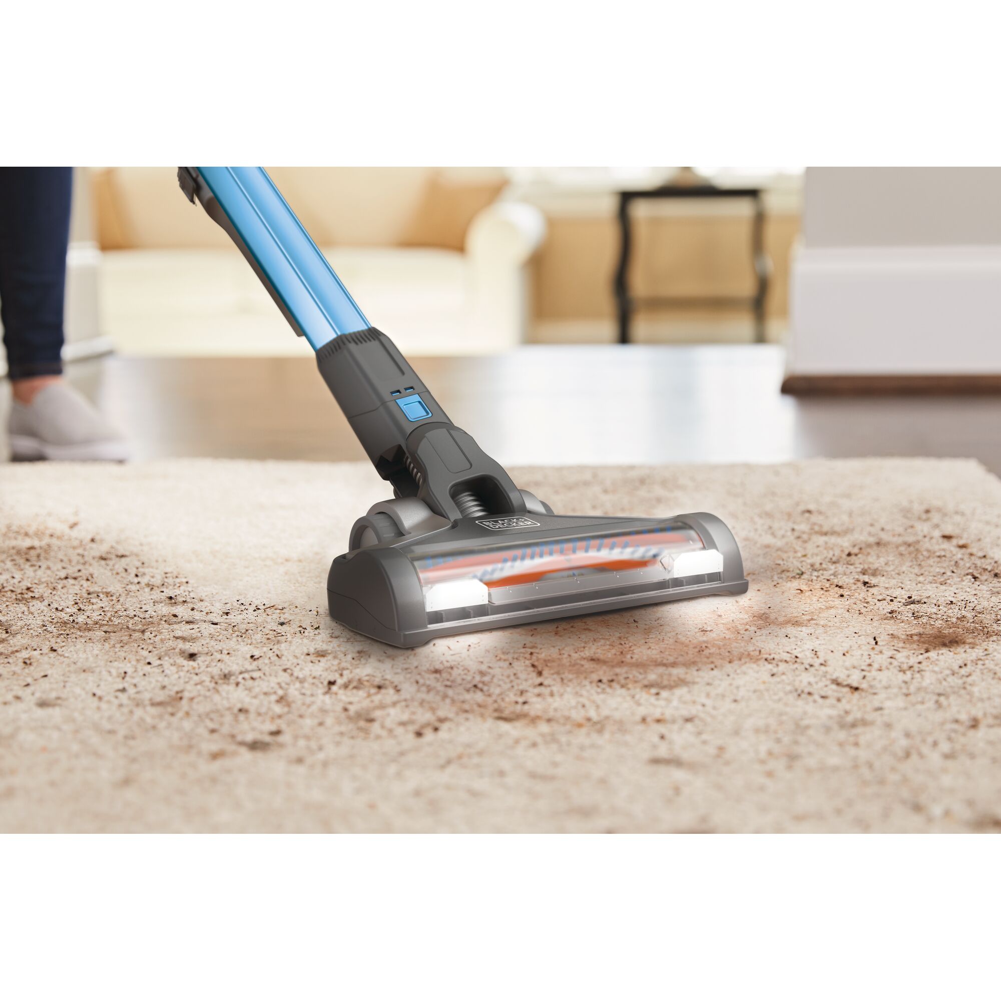 BLACKDECKER BSV2020G stick vacuum cleaning dirt on carpet, close-up, home setting.
