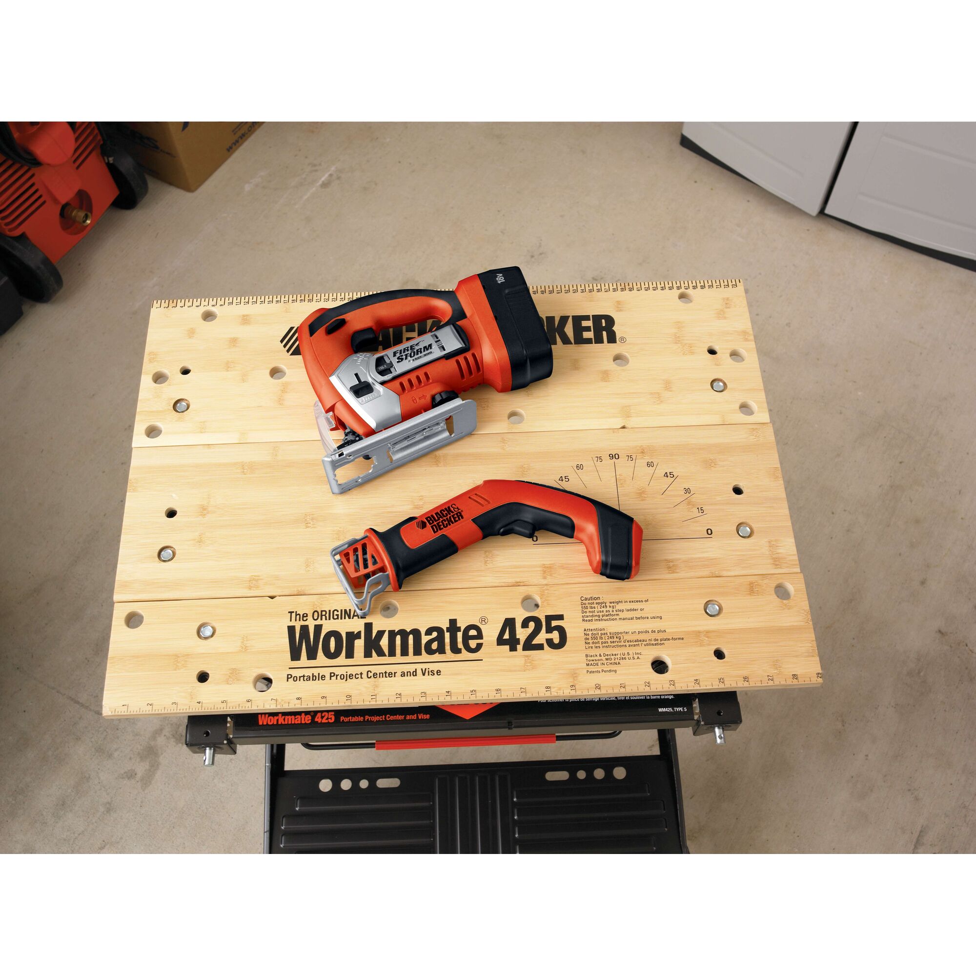 BLACKDECKER CHS6000 cordless handheld saw and Workmate 425 workbench top view, orange and black tools.