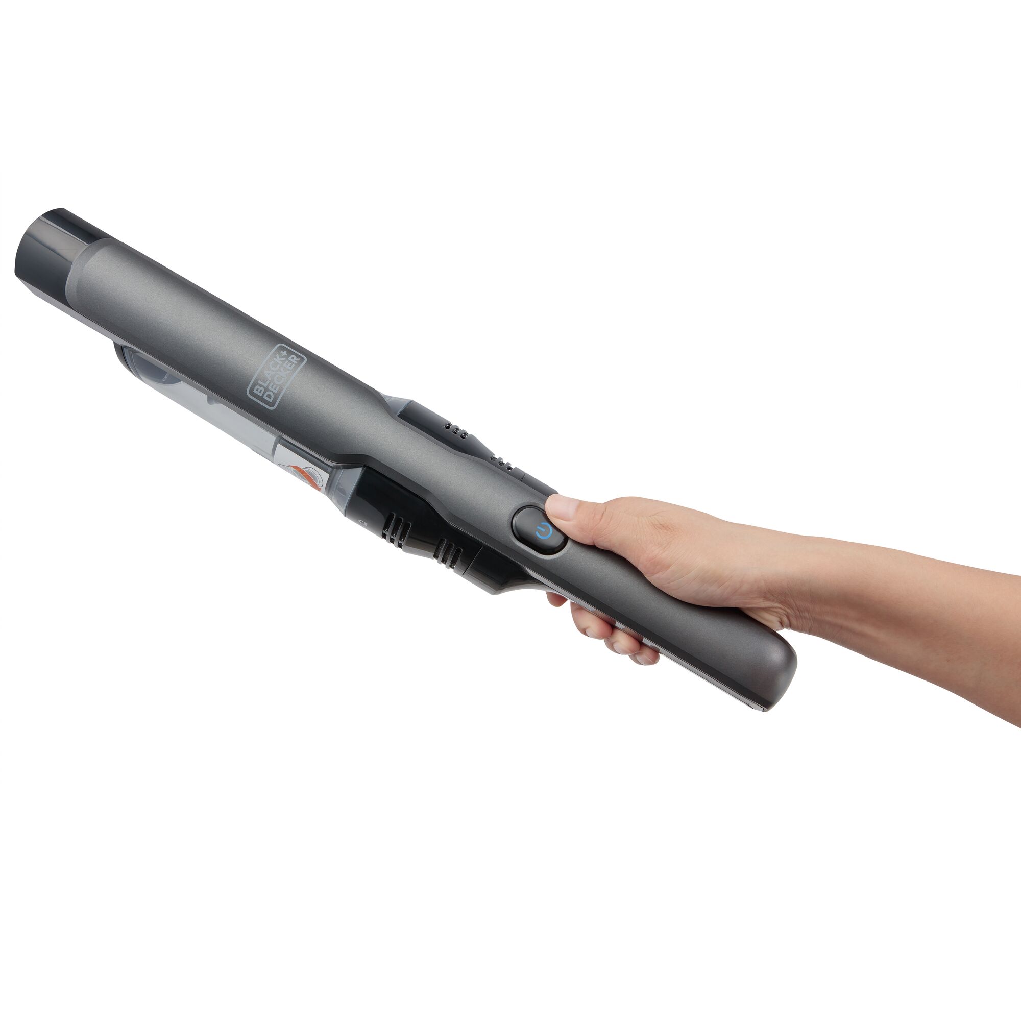 BLACKDECKER DVC320B01 handheld vacuum in grey, side angle, held by a hand, on white background.