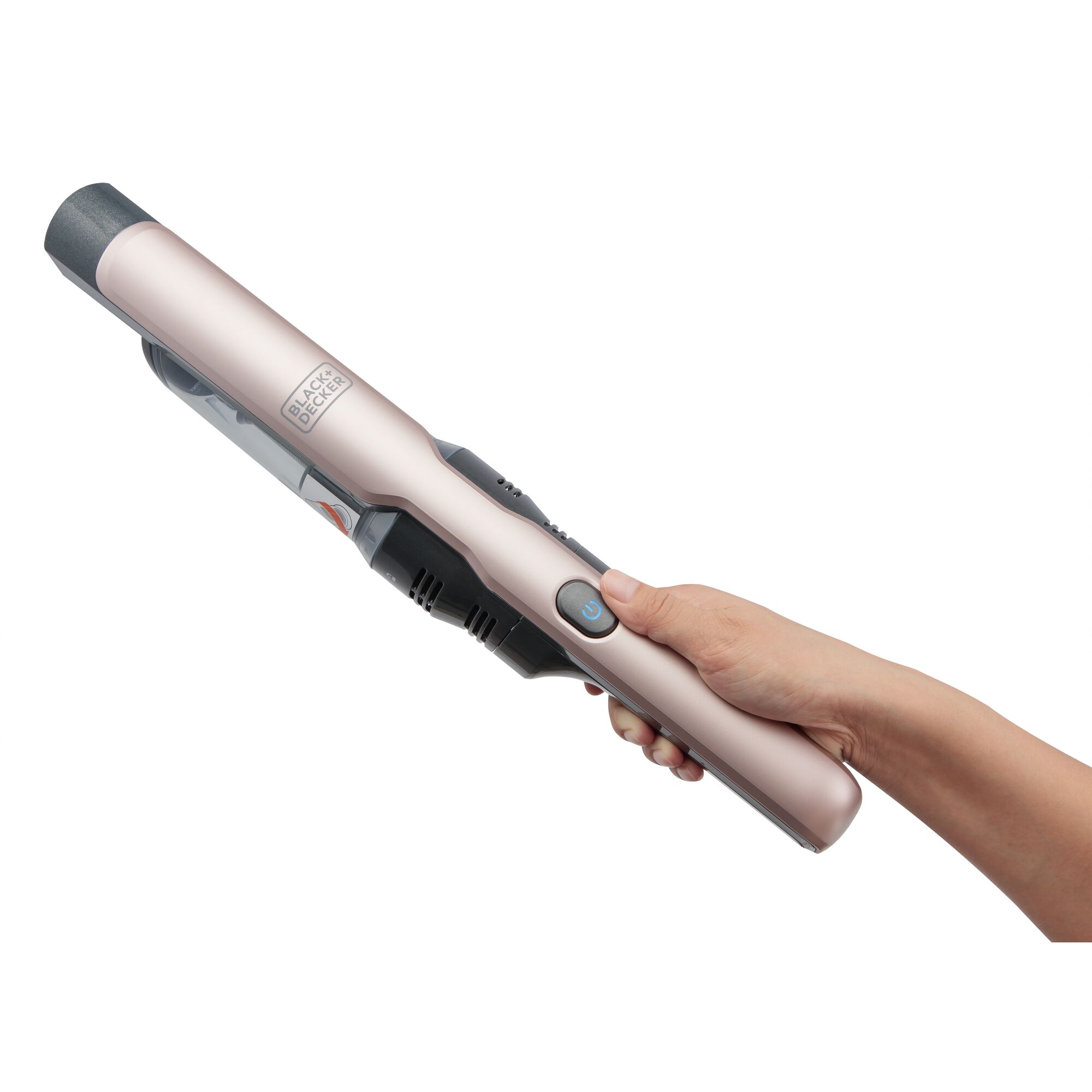 BLACKDECKER DVC320B24 handheld vacuum cleaner in beige shown in a hand, side view, with visible power button.