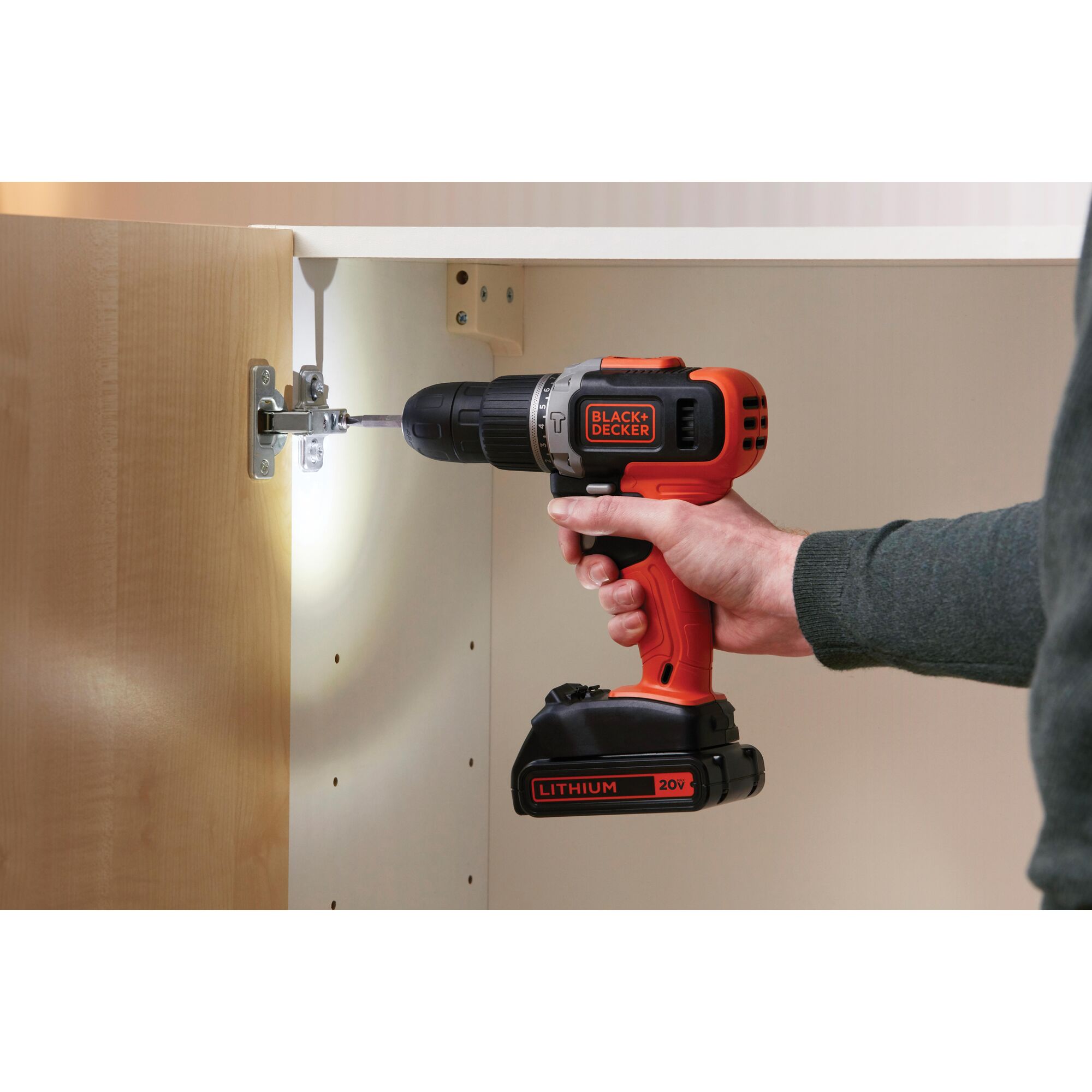 BLACKDECKER EBCD704 cordless drill with 20V lithium battery used to assemble cabinet.