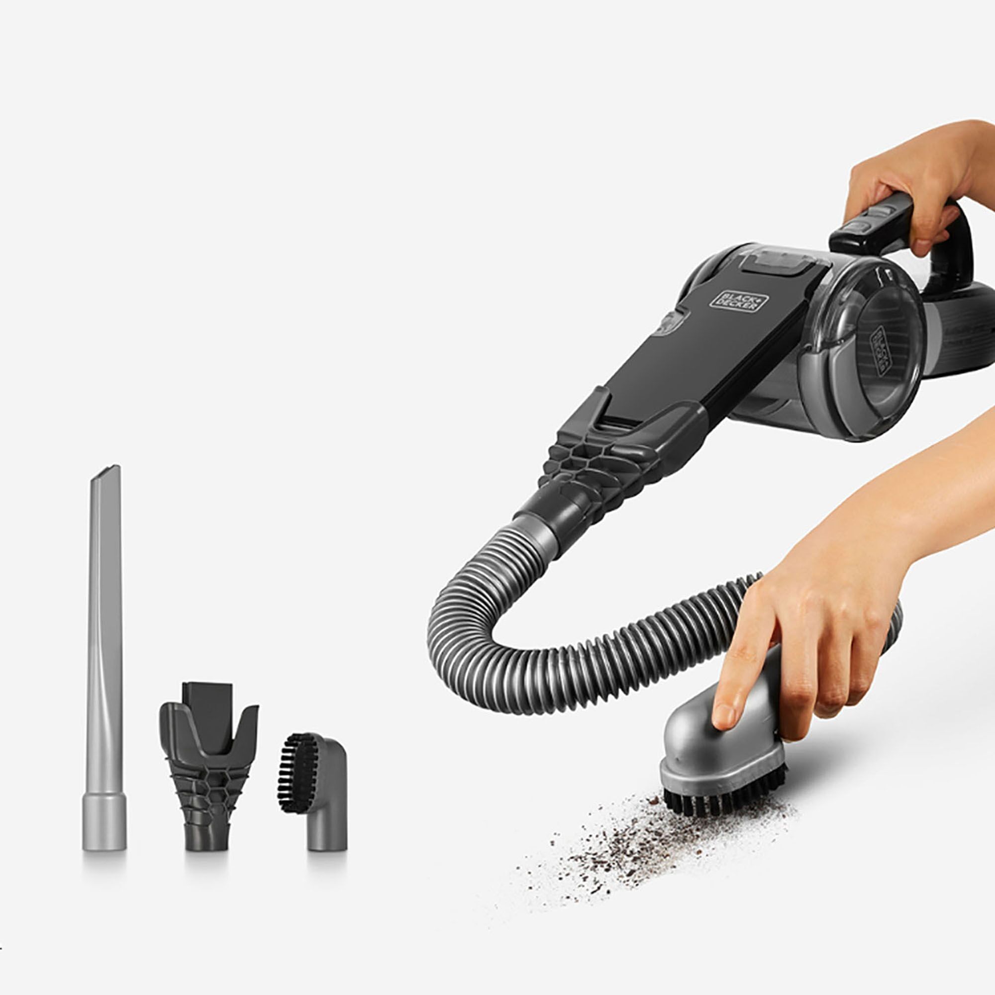 BLACKDECKER EPV1020BKA-KR handheld vacuum with hose and three attachments, side angle, cleaning dirt.