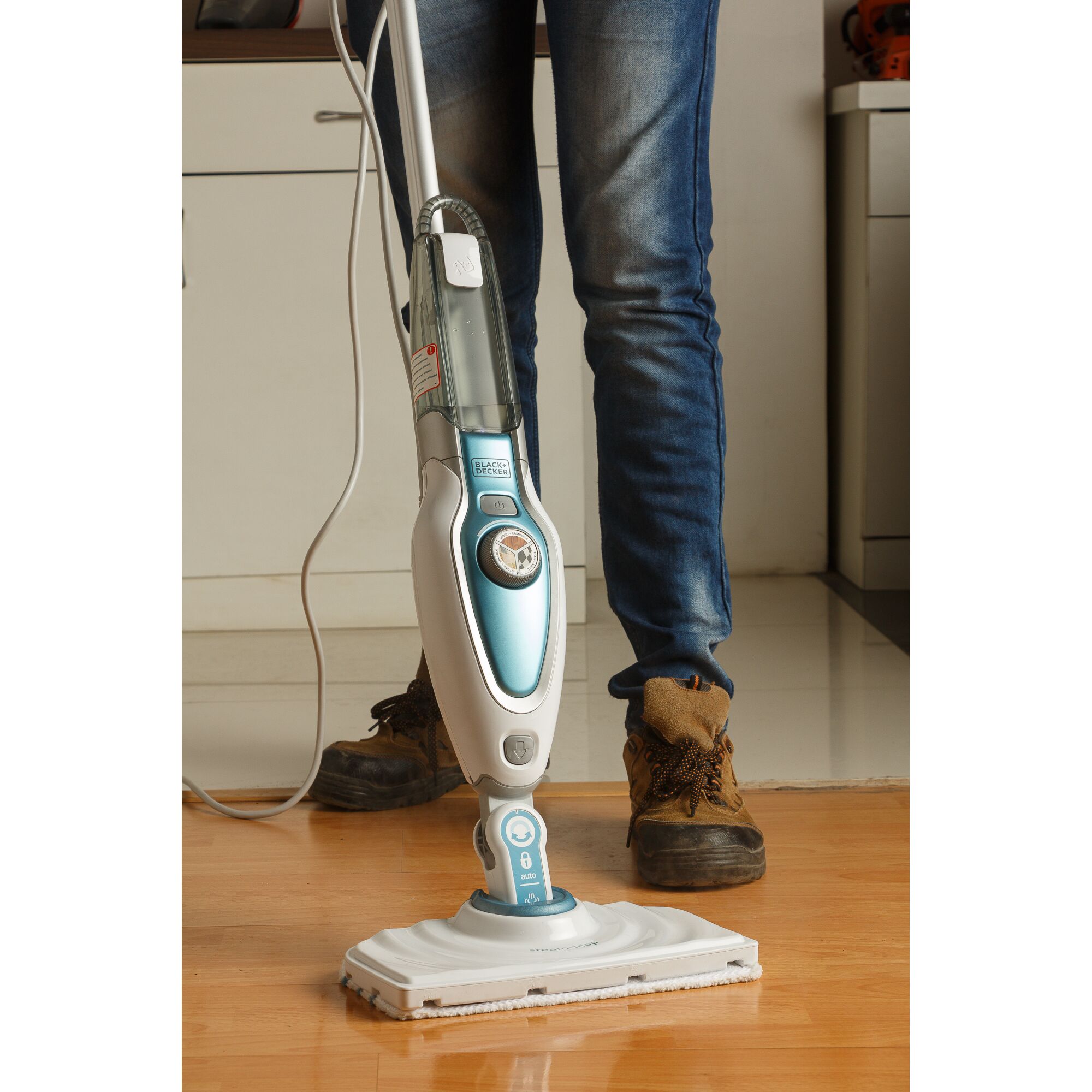 BLACKDECKER FSM1620 steam mop cleaning wooden floor, blue and white, close-up photography.