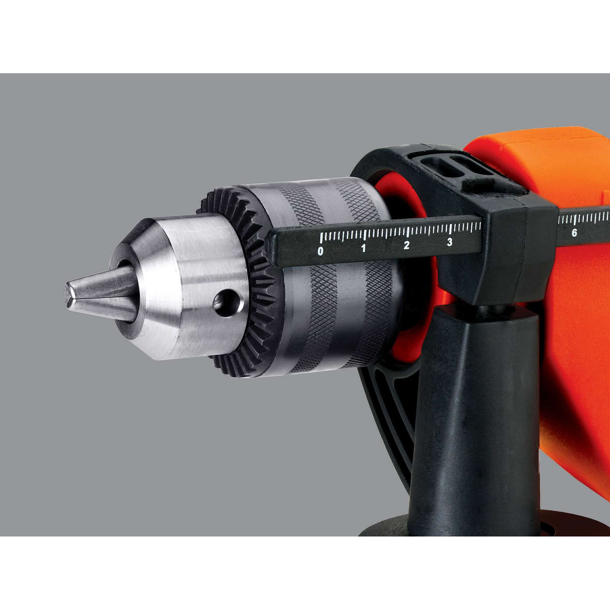 BLACKDECKER HD555 close-up side view of orange drill with metallic chuck and depth gauge.