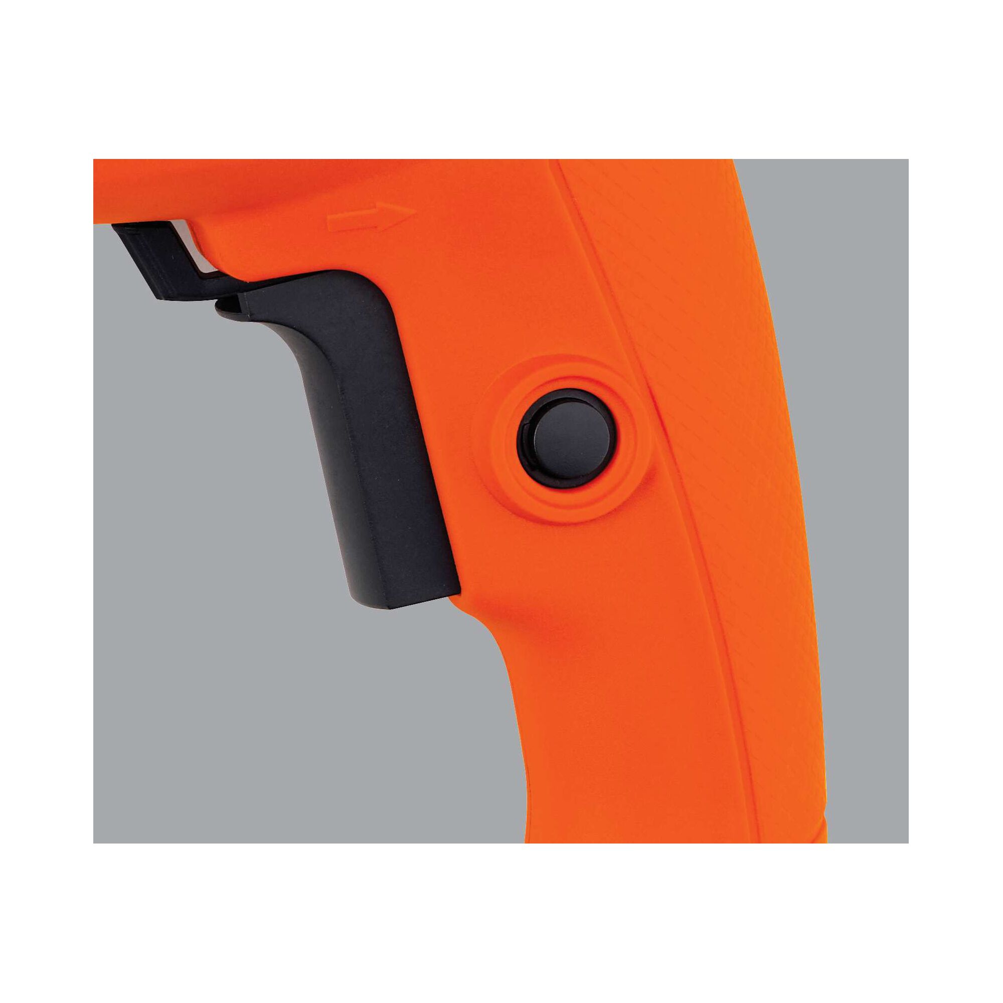 BLACKDECKER HD555 orange drill handle close-up with trigger and black button, right side angle.