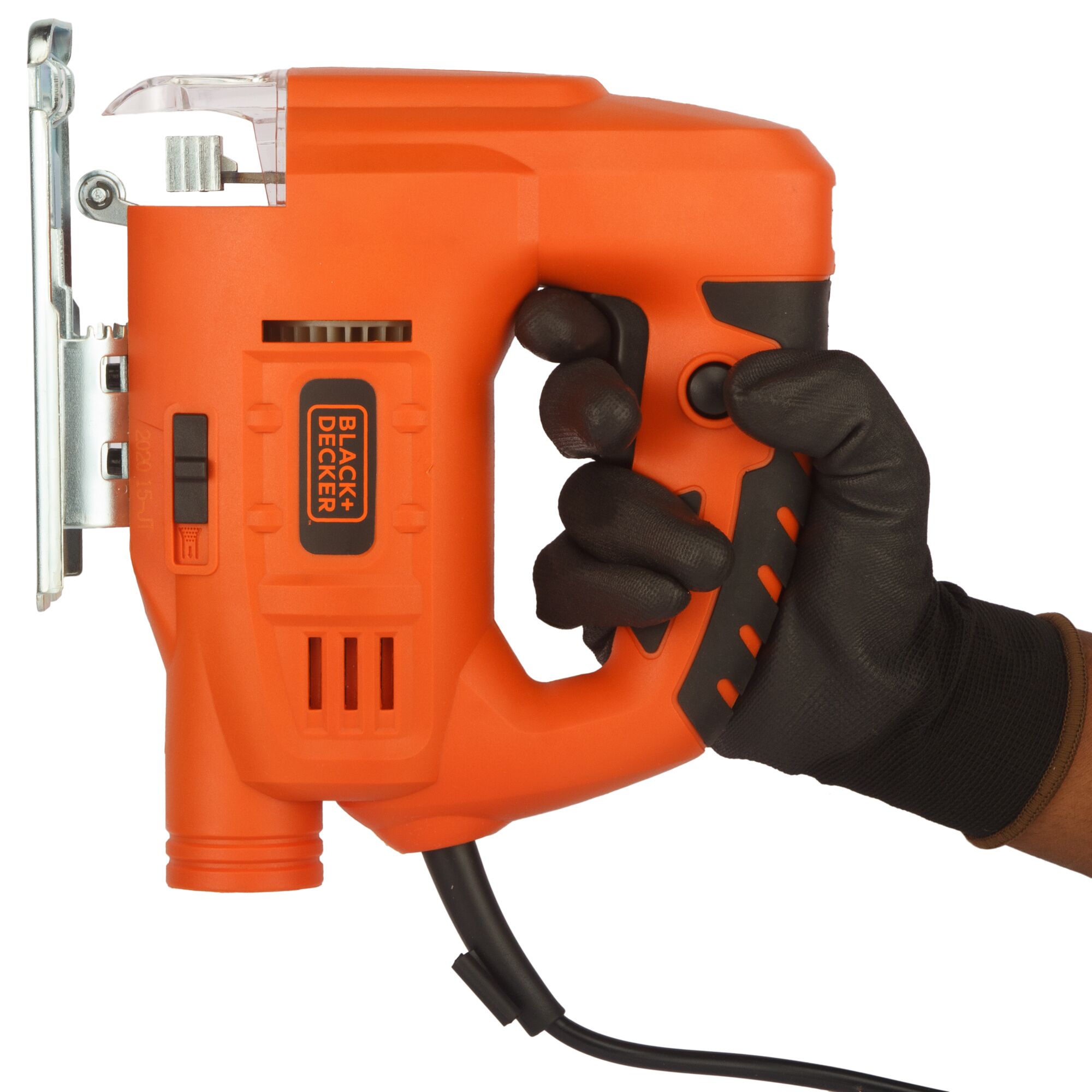 Photo of BLACKDECKER JS20 orange jigsaw held by a gloved hand, side angle, black accents, cord visible.