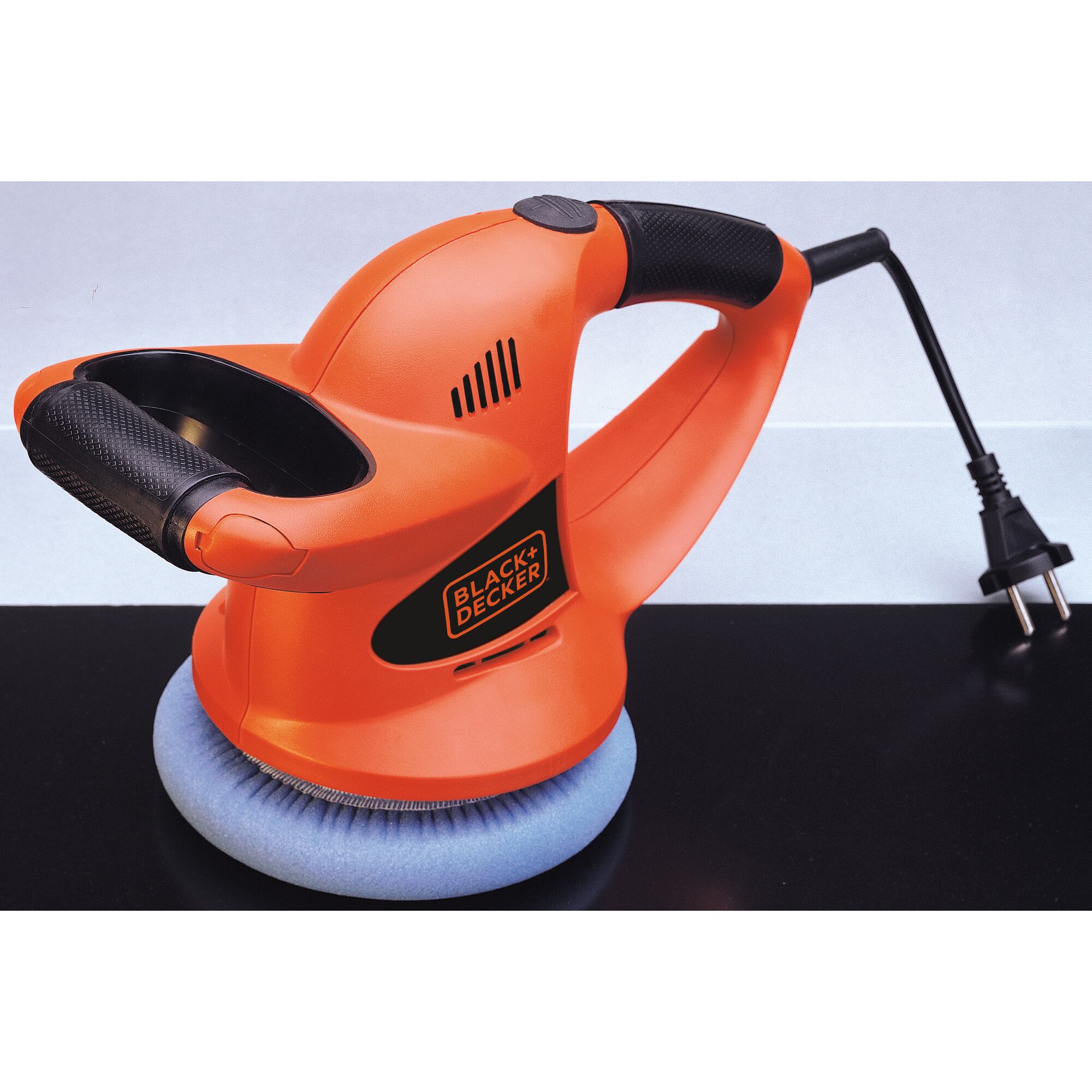 BLACKDECKER KP600 orange electric car polisher with black handle and blue foam pad, side angle view.
