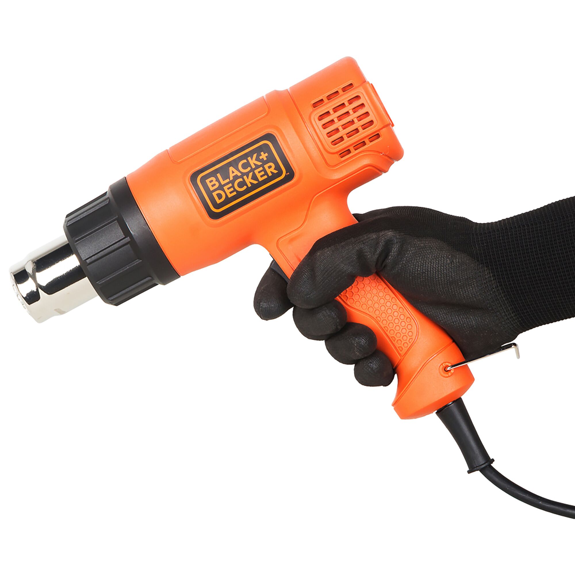 BLACK+DECKER KX1800 orange heat gun held in gloved hand, side angle, product category photography