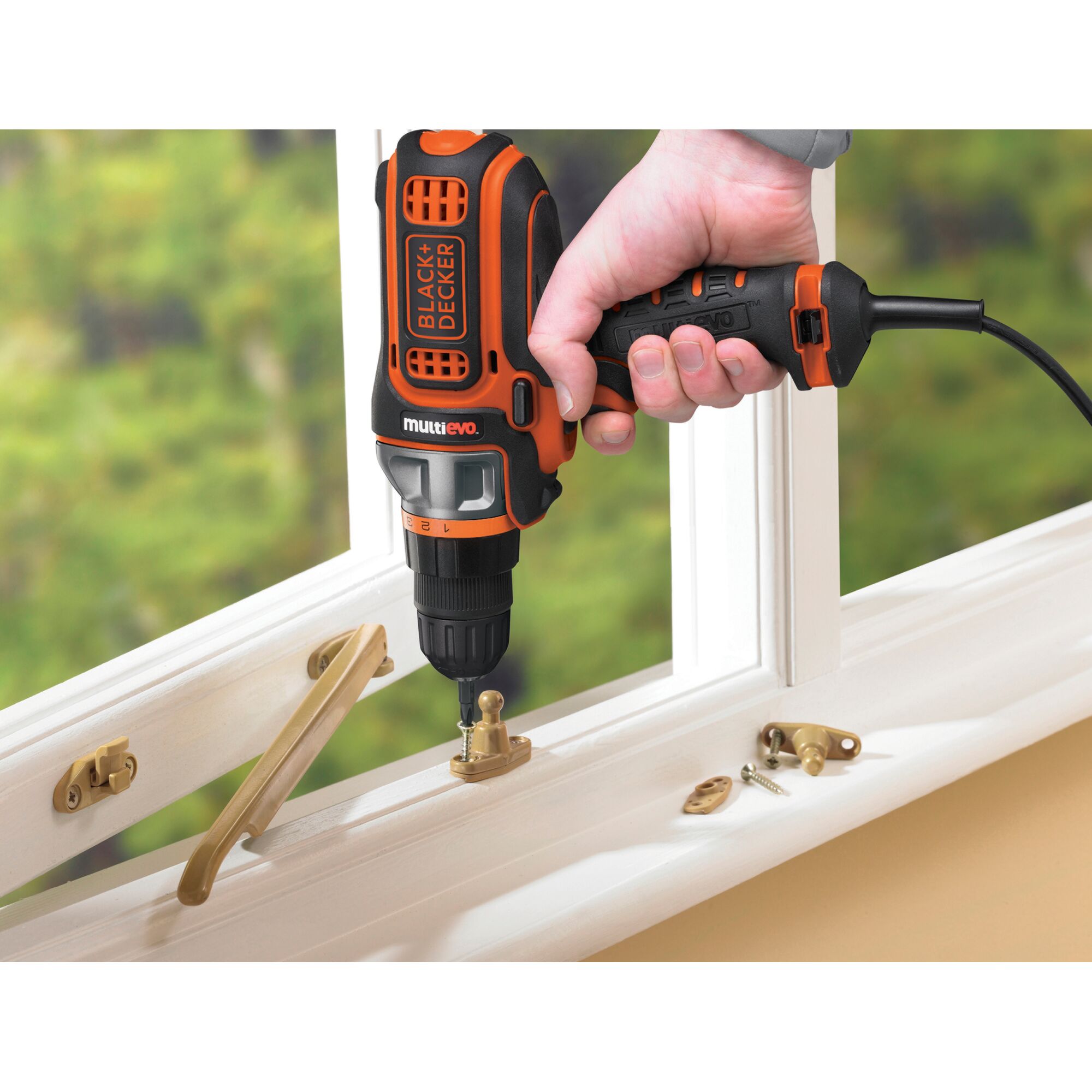 BLACKDECKER MT350k multi-tool drill used for window hardware installation, close-up view.
