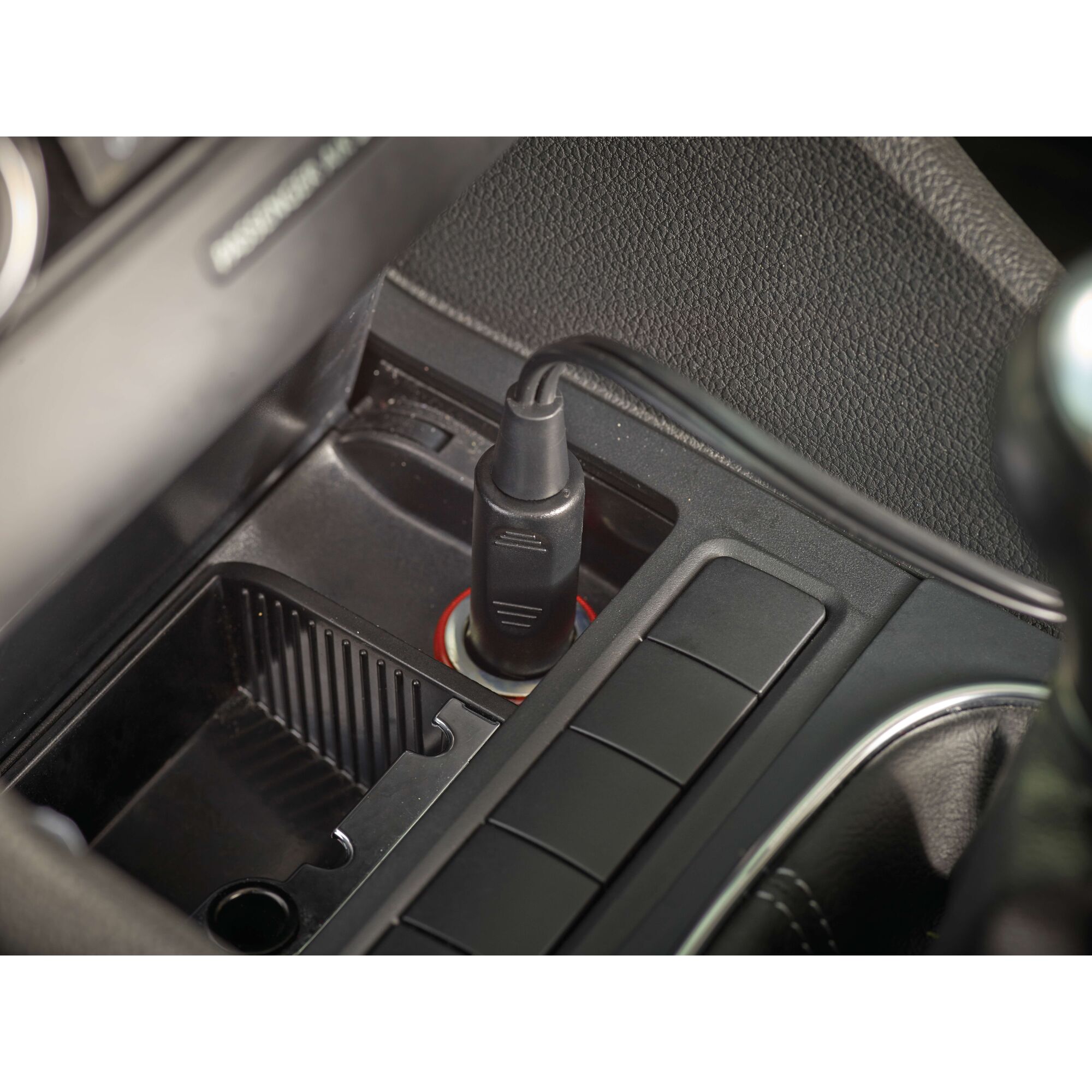 BLACKDECKER NV1210AV car vacuum power plug in vehicle cigarette lighter socket, close-up view.