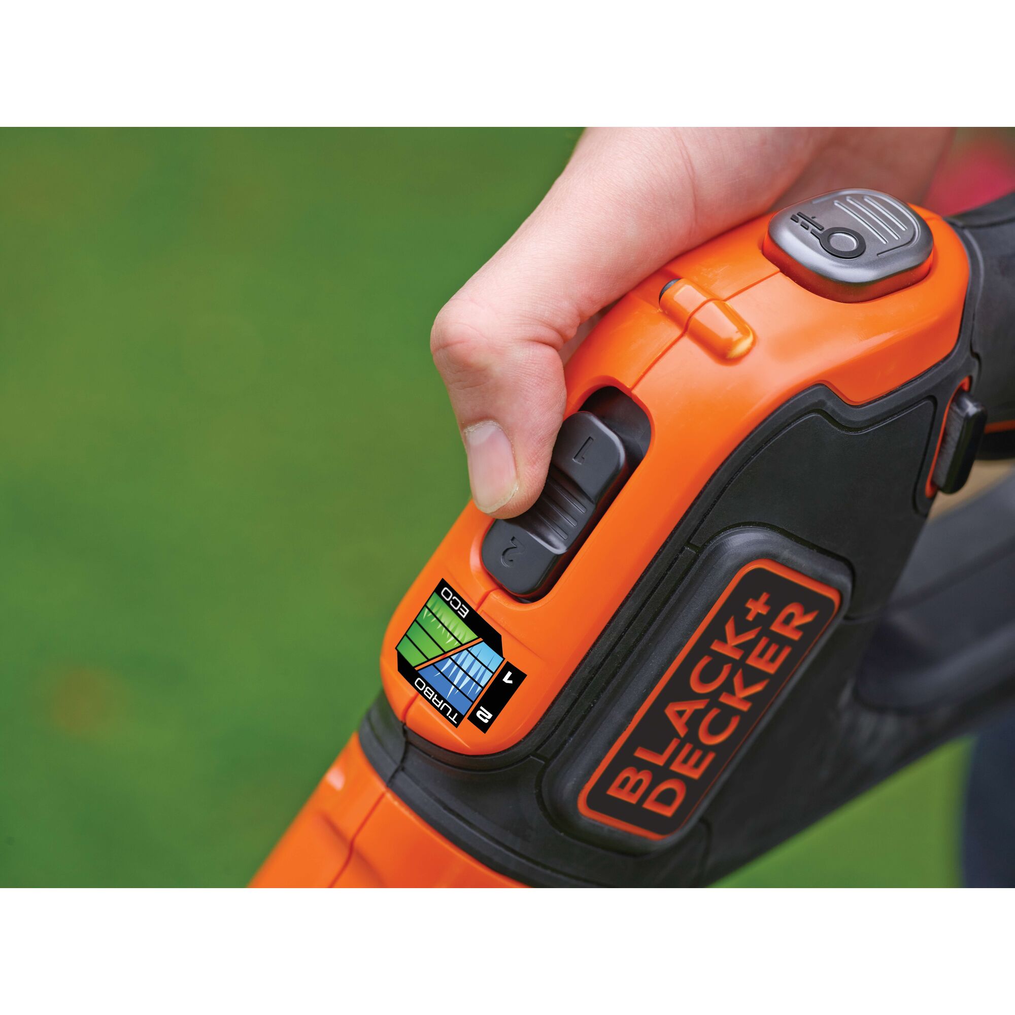 Photo of BLACKDECKER STC1820EPC lawn trimmer handle with speed control buttons and label.