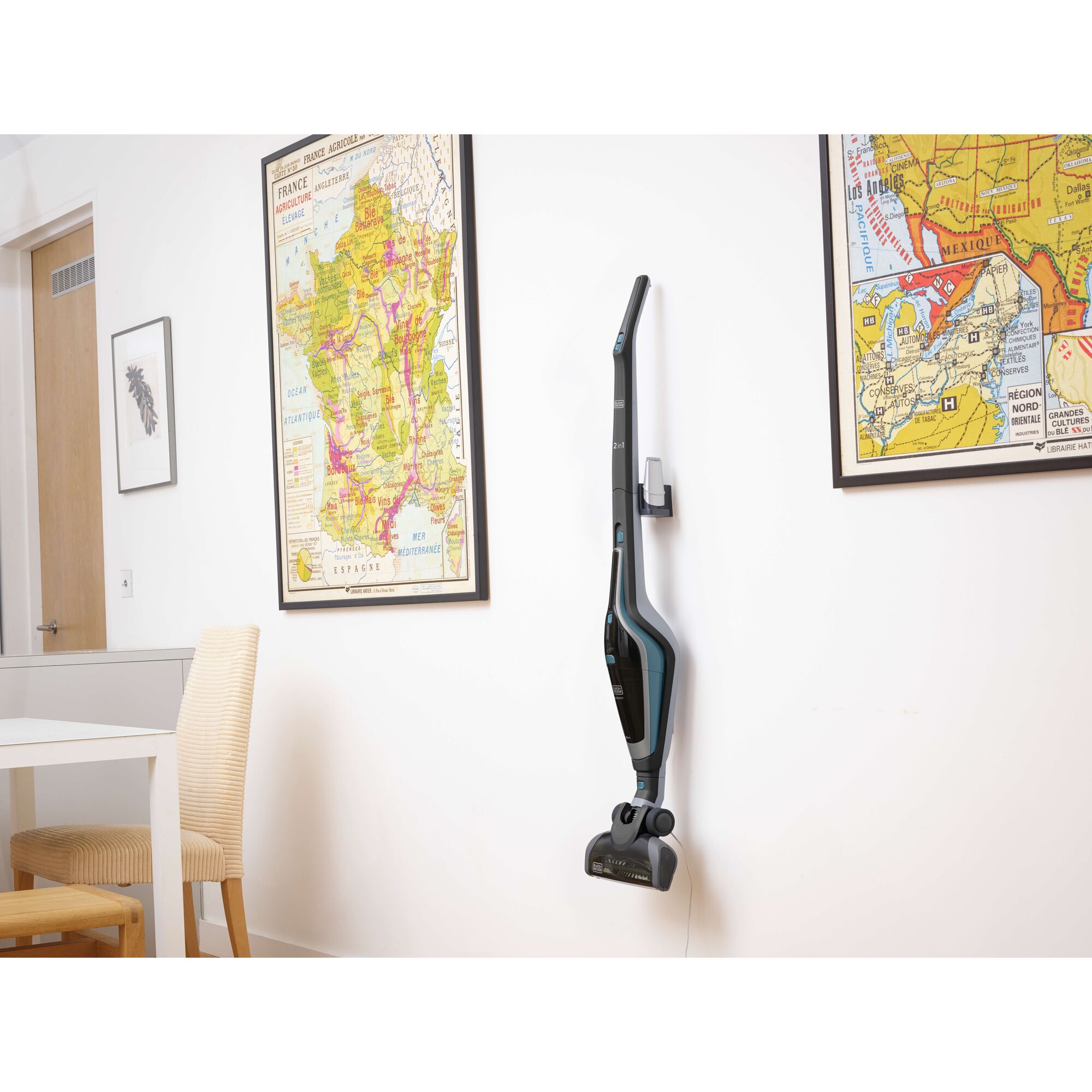 BLACKDECKER SVA420B cordless stick vacuum mounted on wall in modern room, side angle.
