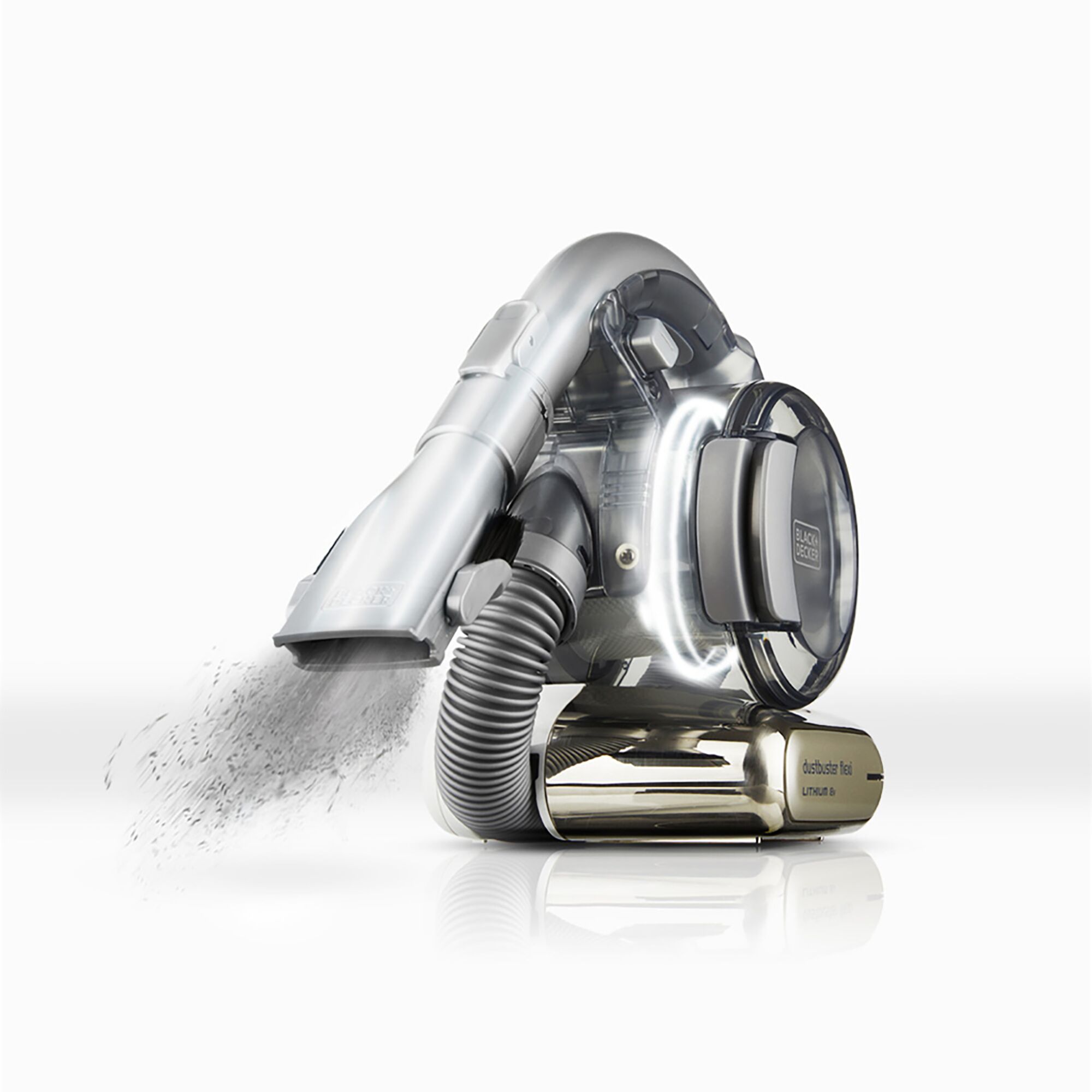 BLACKDECKER TPD1810BGEXT-KR handheld vacuum in silver, dust being emitted, side angle.