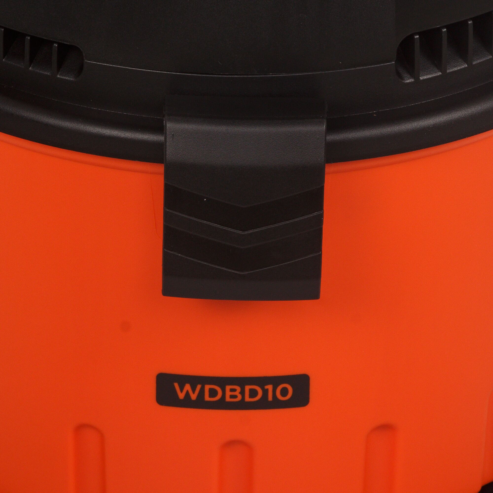 BLACKDECKER WDBD10 vacuum cleaner front view showing orange body and black latch.