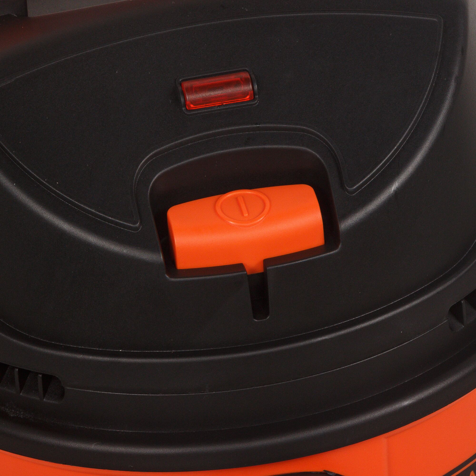 BLACKDECKER WDBD10 vacuum top control switch in black and orange, close-up angle.