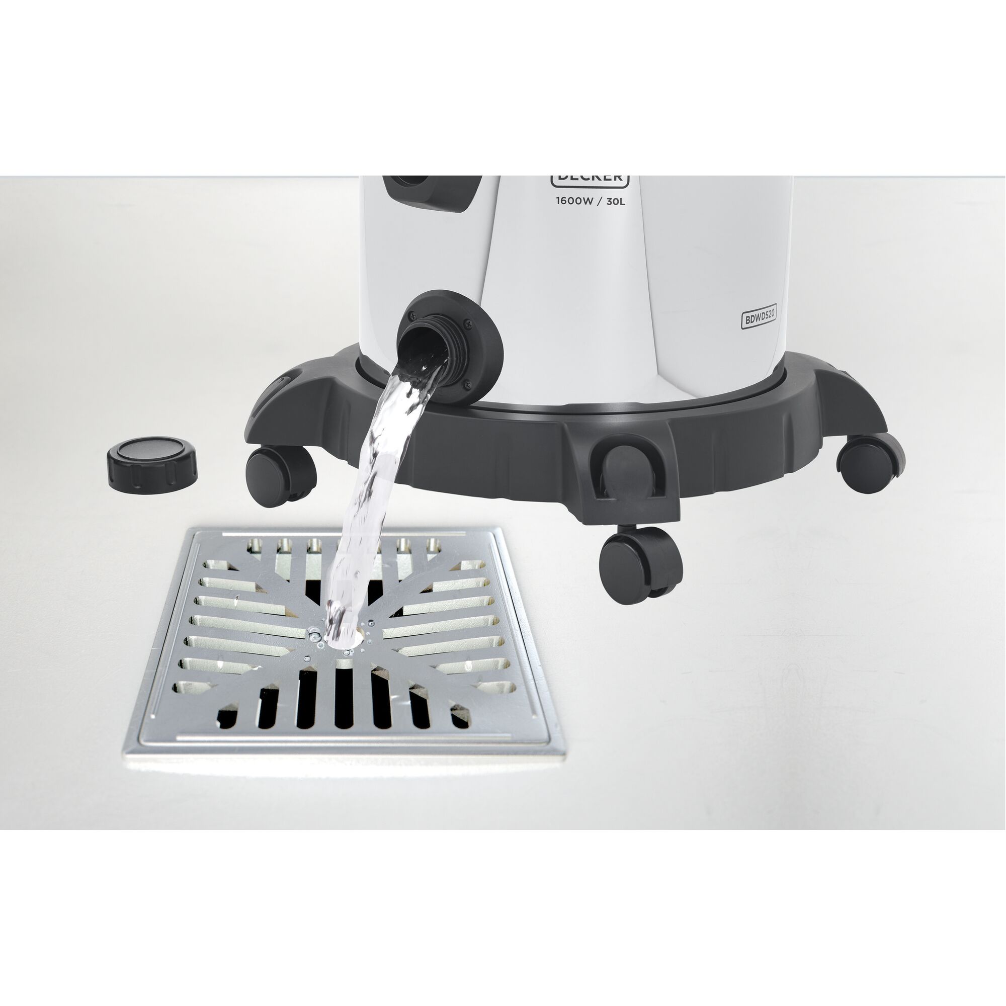 BLACKDECKER WDBDS30 wet dry vacuum draining water into floor drain, white background, side angle.