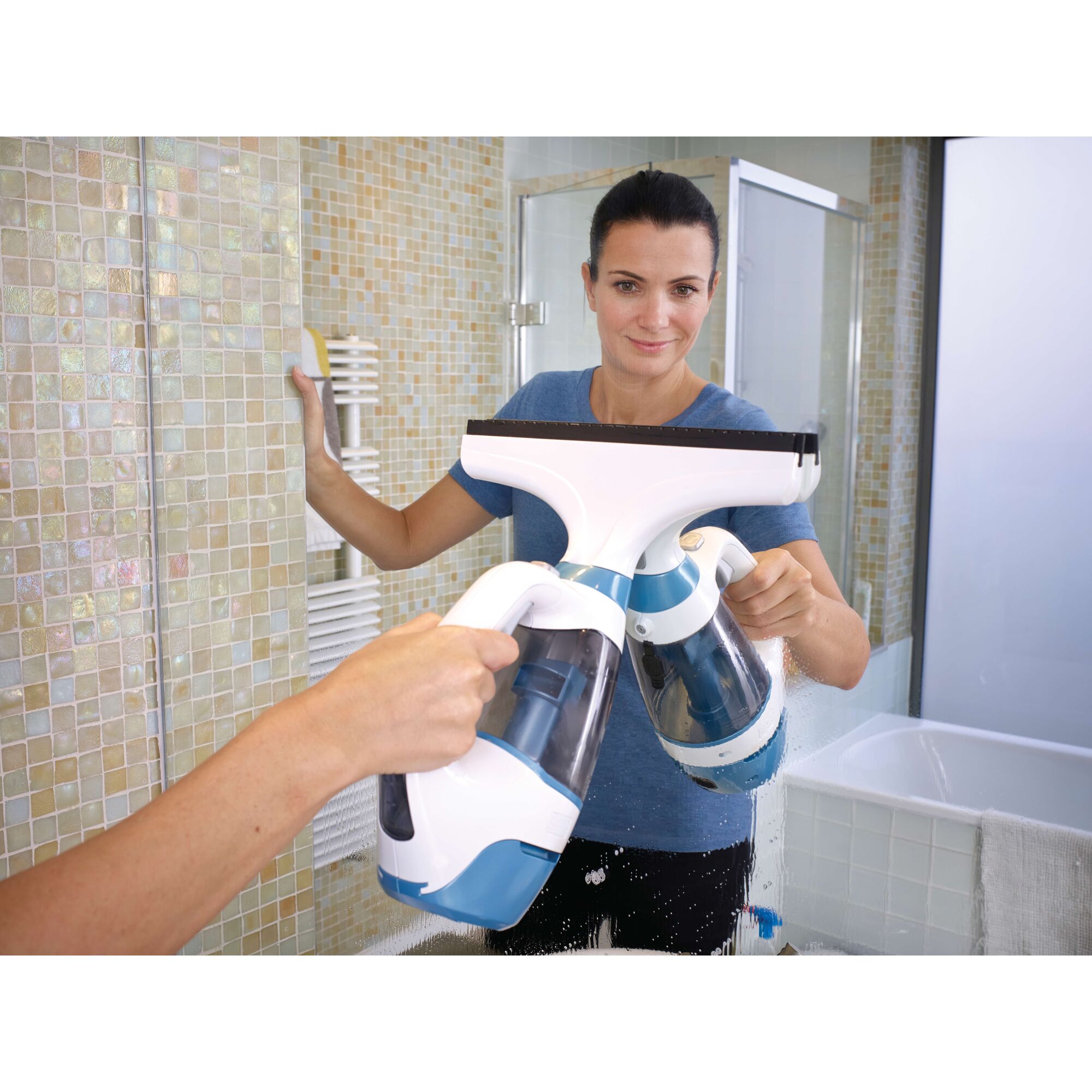 BLACKDECKER WW100 window vacuum cleaner used on bathroom mirror, handheld, blue and white design.
